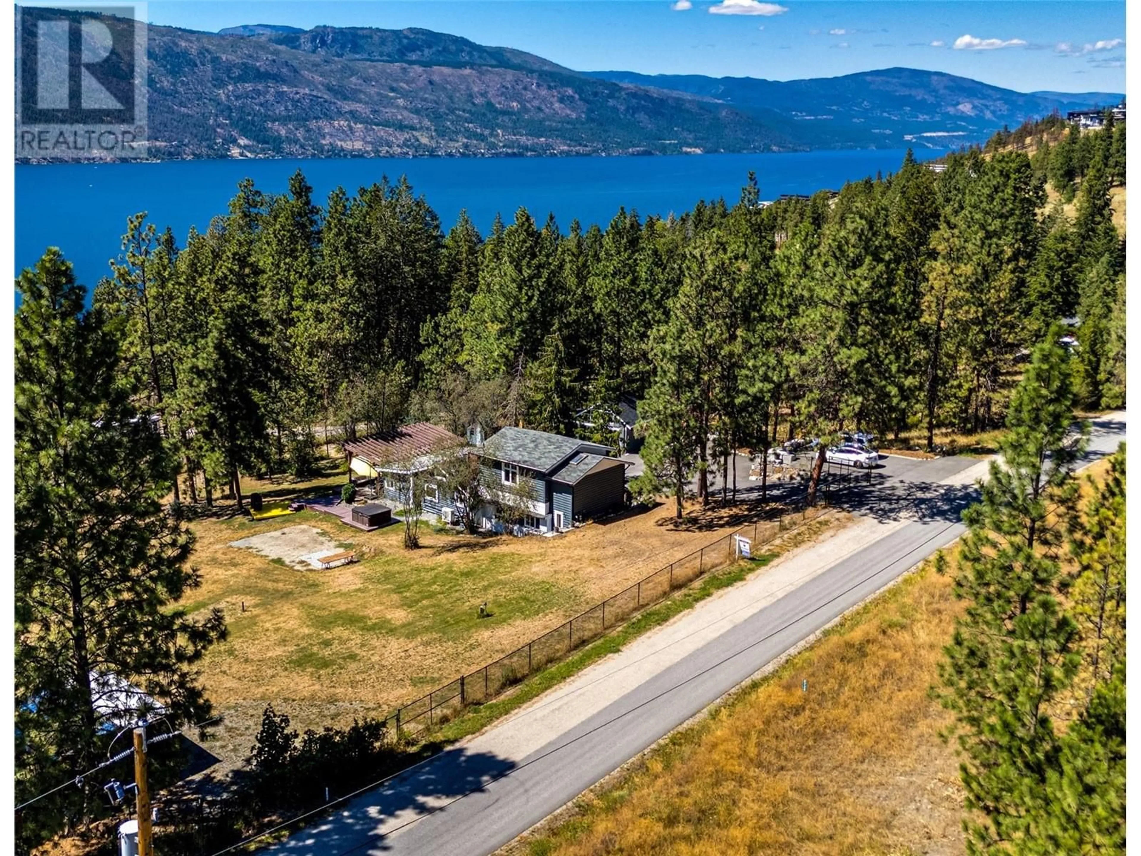 A pic from outside/outdoor area/front of a property/back of a property/a pic from drone, water/lake/river/ocean view for 5555 Stubbs Road, Lake Country British Columbia V4V1N1