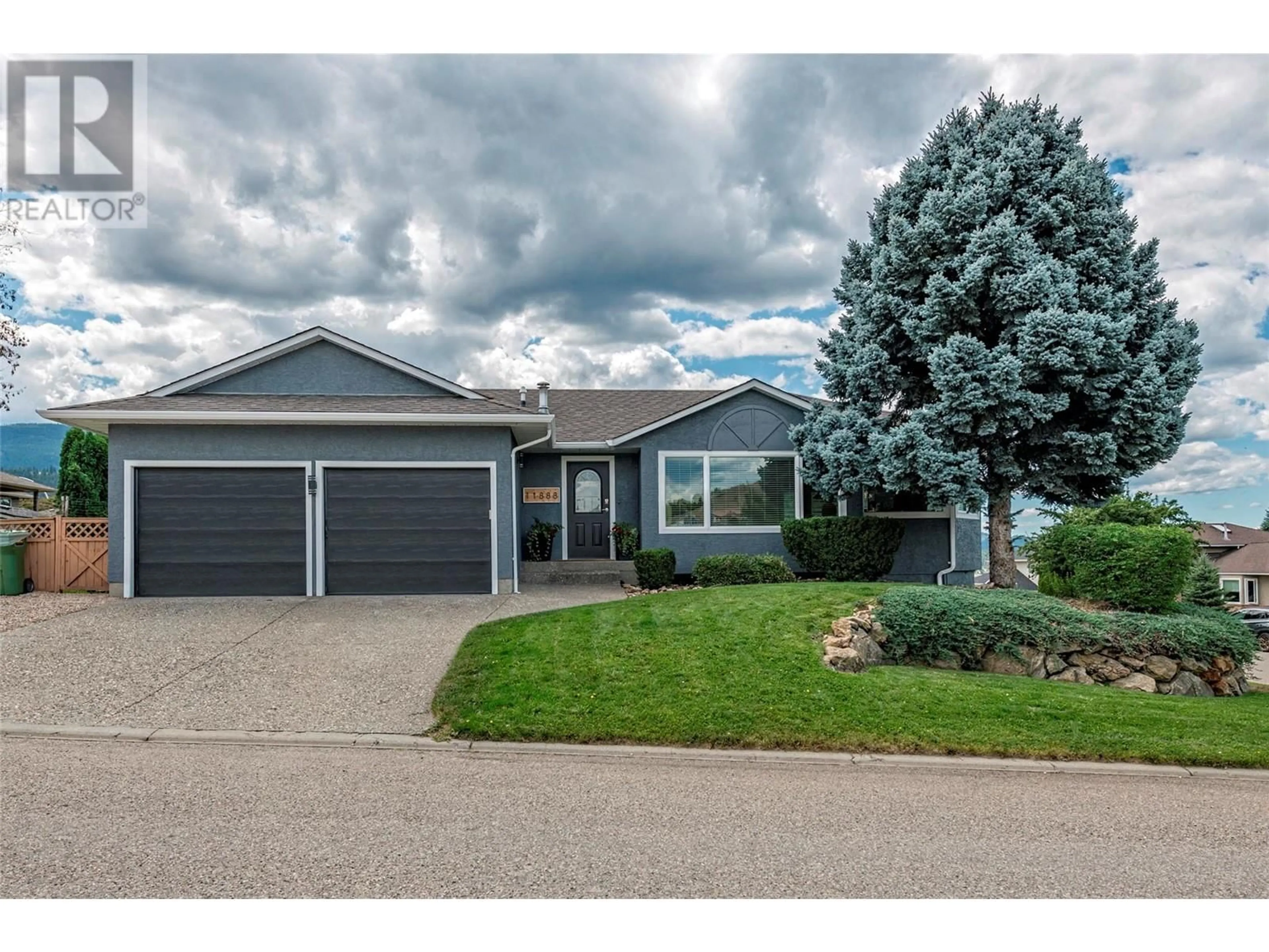 Home with vinyl exterior material, street for 11888 Lambert Drive, Coldstream British Columbia V1B2P4