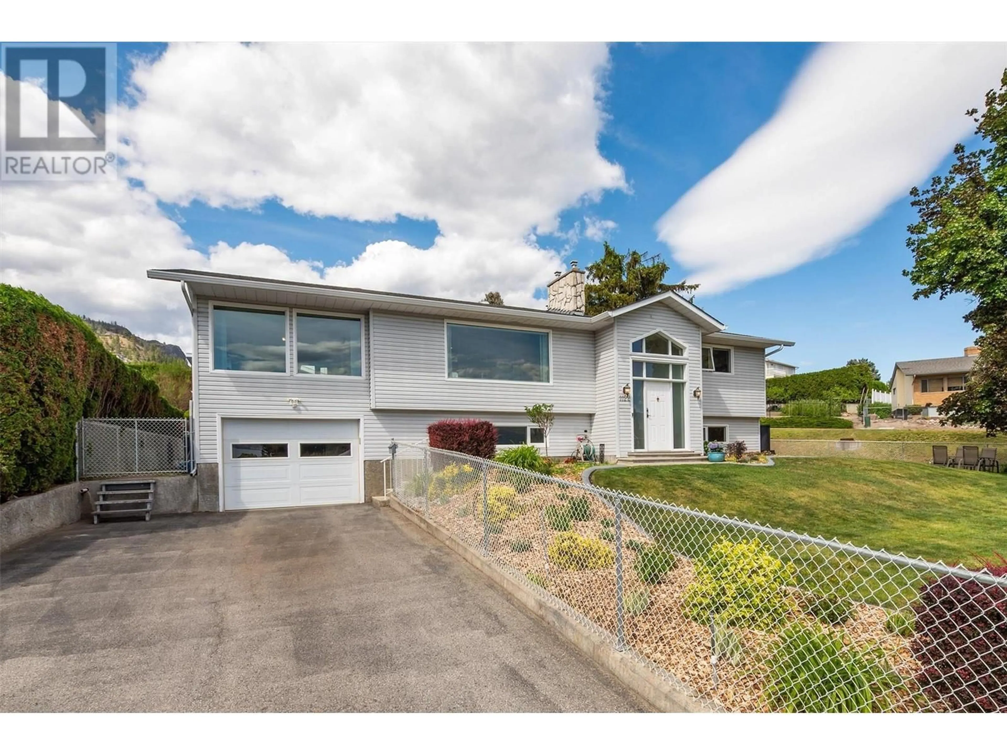 A pic from outside/outdoor area/front of a property/back of a property/a pic from drone, street for 1122 Allison Place, West Kelowna British Columbia V1Z2E3