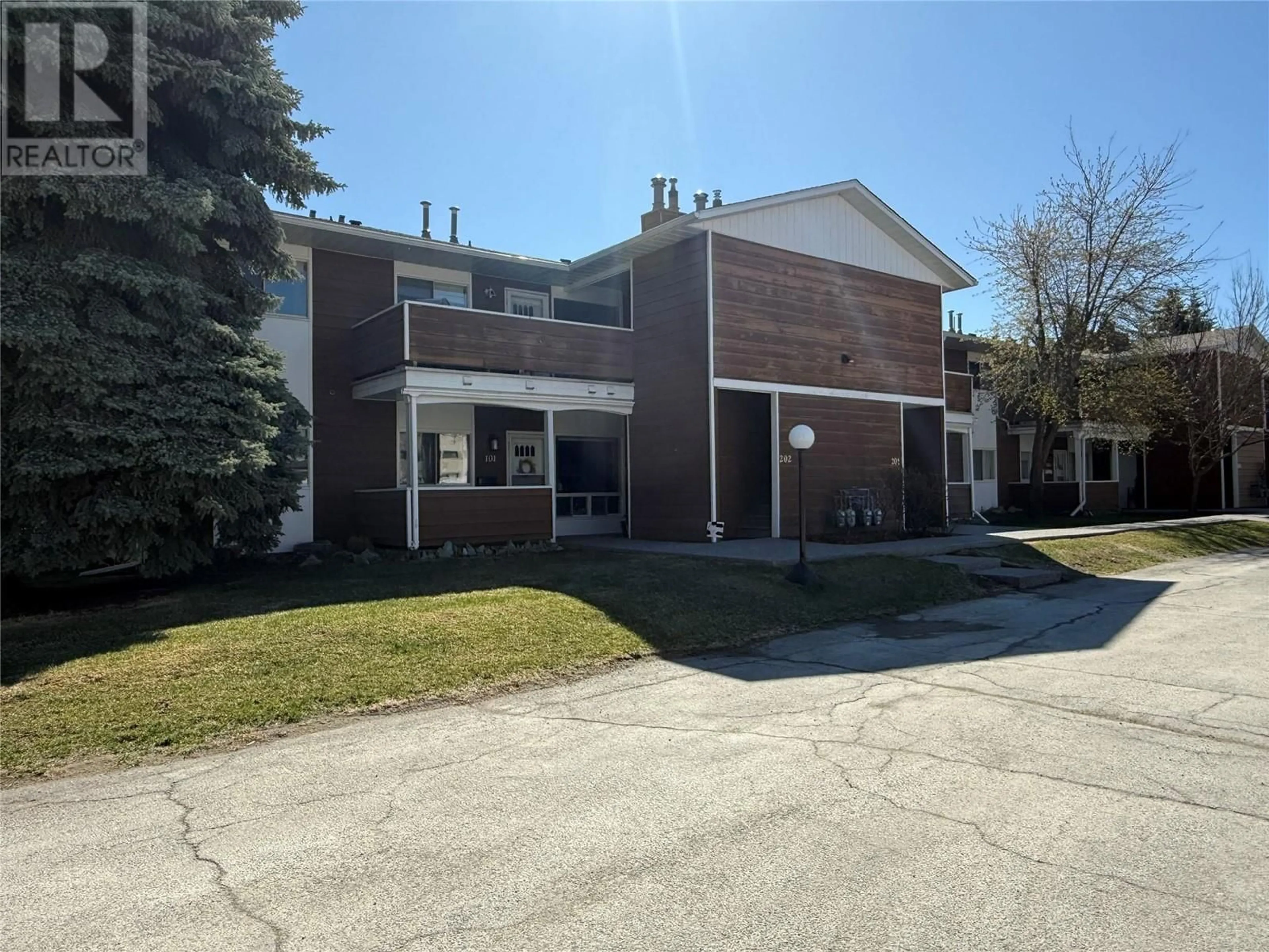 A pic from outside/outdoor area/front of a property/back of a property/a pic from drone, street for 202 - 2365 12 STREET NORTH, Cranbrook British Columbia V1C5T4
