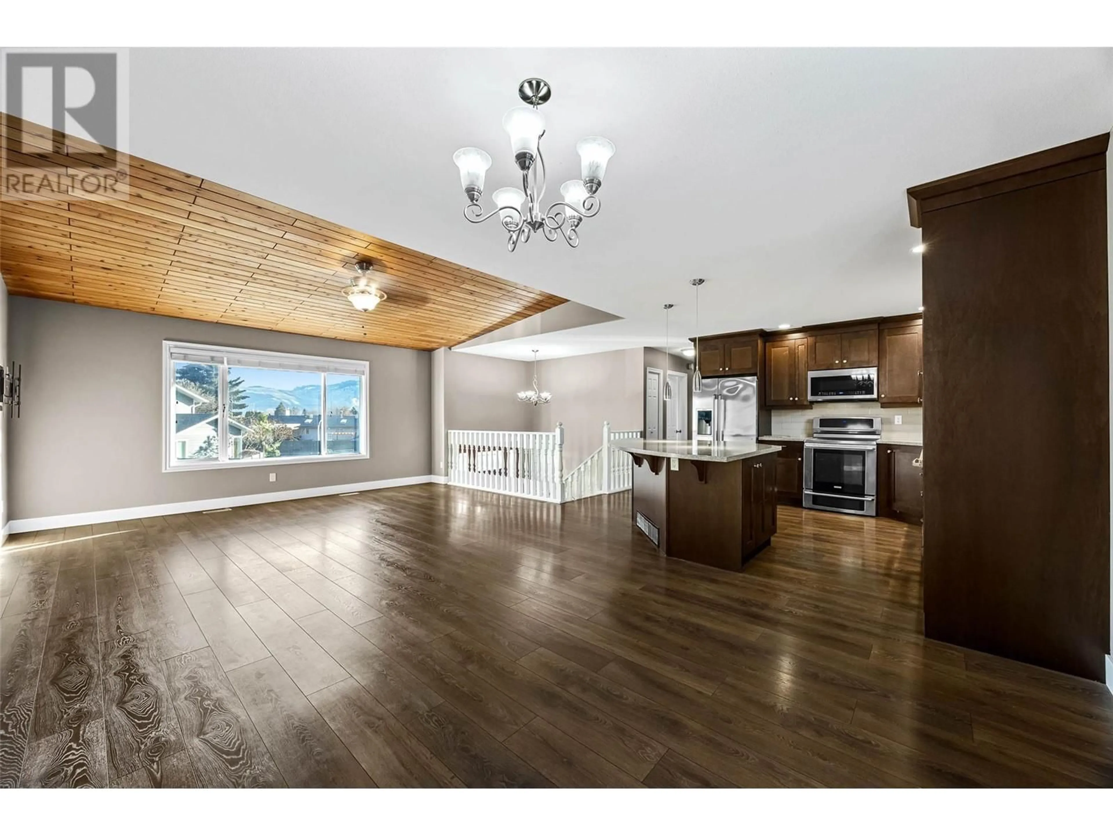 Open concept kitchen, wood/laminate floor for 2298 Bossert Avenue, Kamloops British Columbia V2B8H5