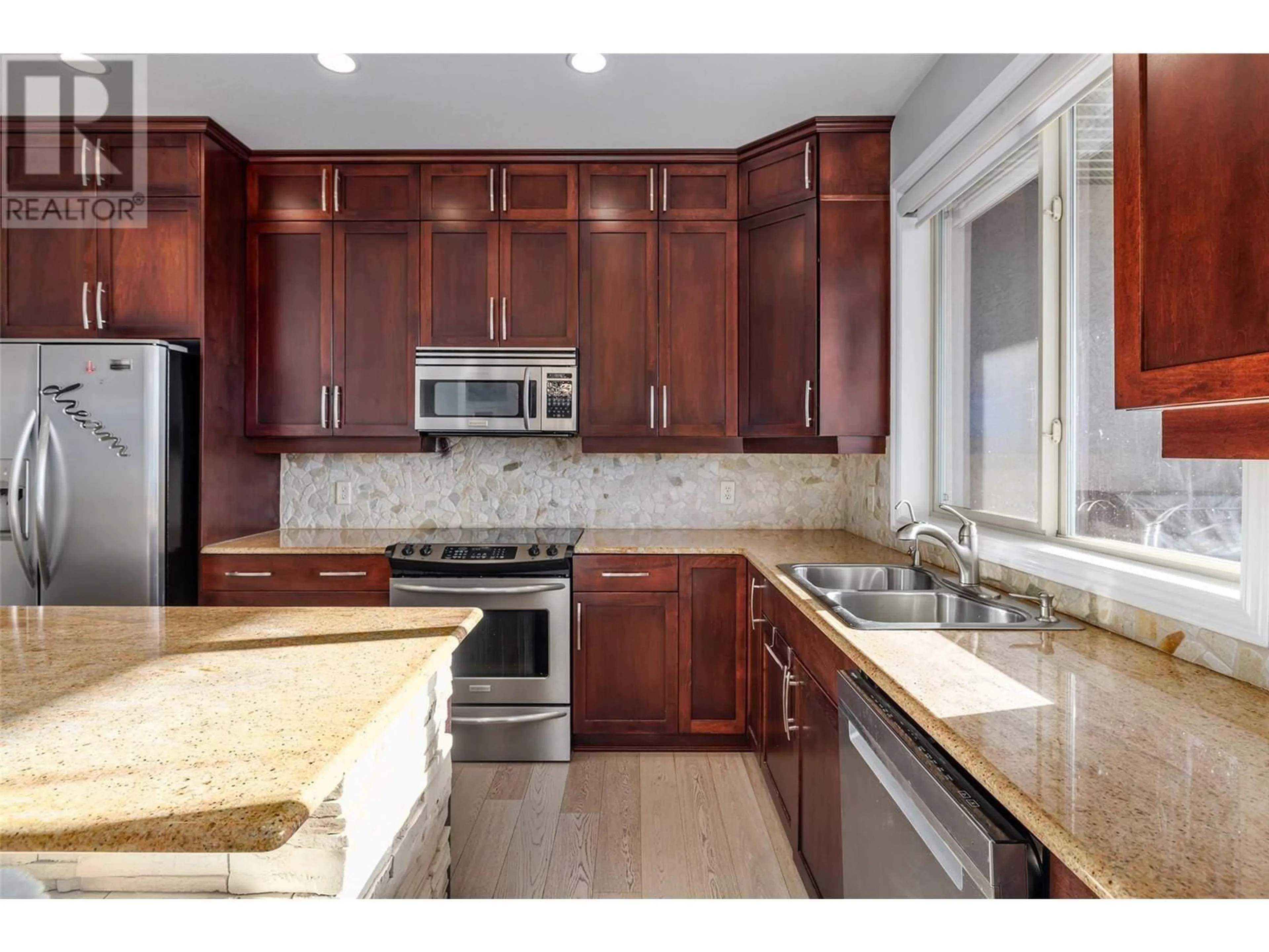 Open concept kitchen, ceramic/tile floor for 5165 Trepanier Bench Road Unit# 256, Peachland British Columbia V0H1X2