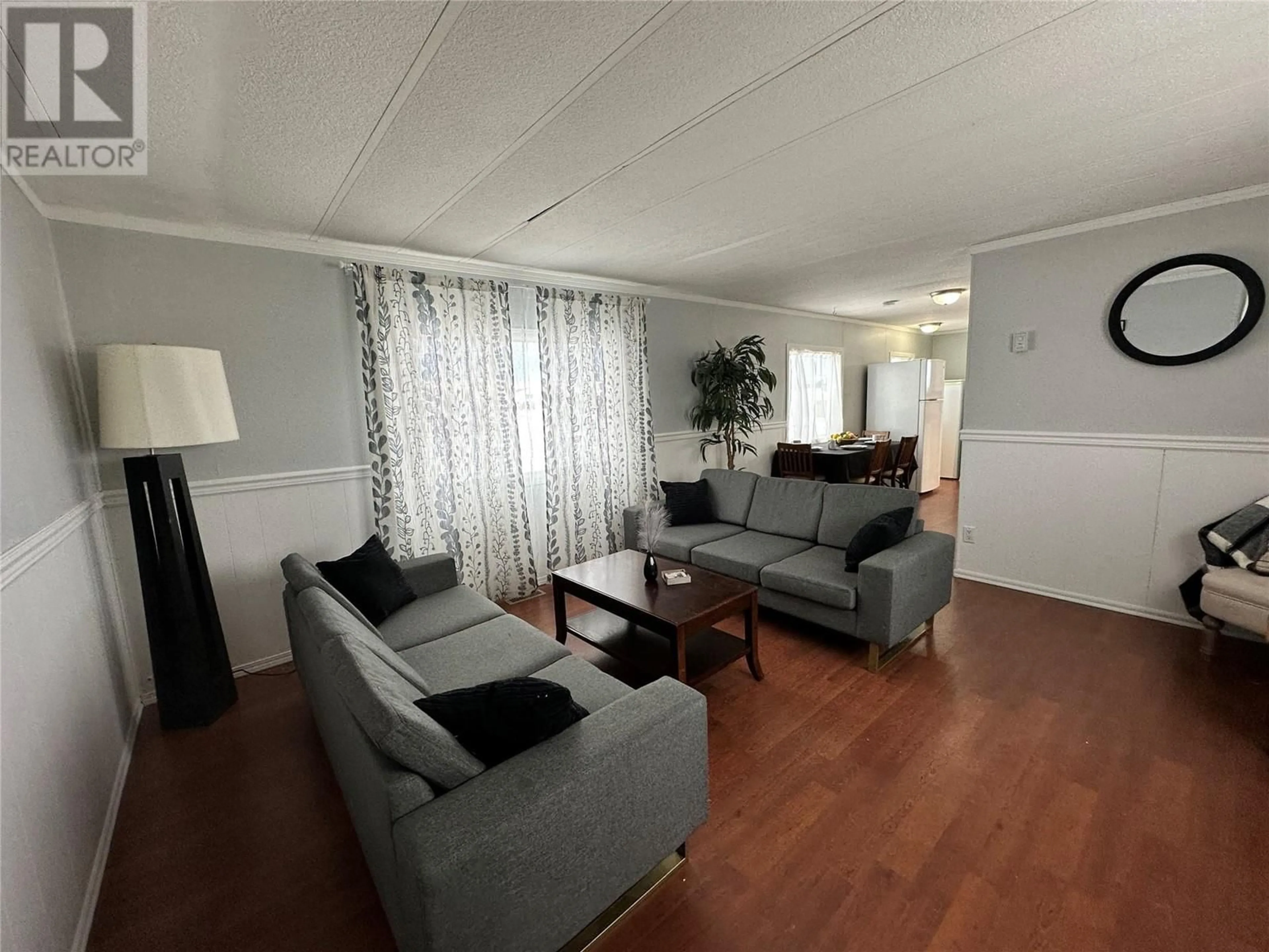 Living room with furniture, wood/laminate floor for 1201 118 Avenue Unit# 82, Dawson Creek British Columbia V1G4L2