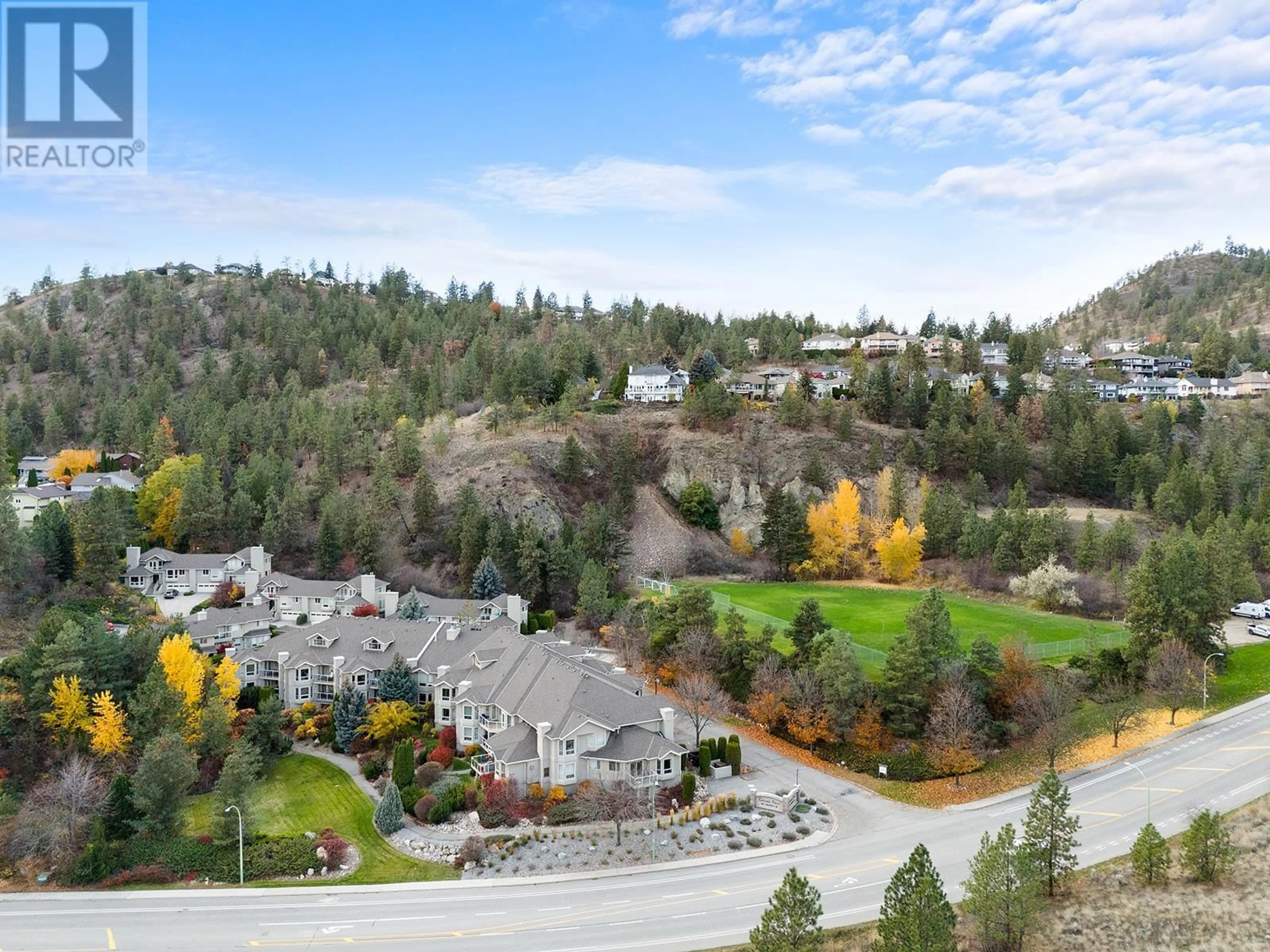 A pic from outside/outdoor area/front of a property/back of a property/a pic from drone, mountain view for 980 Dilworth Drive Unit# 107, Kelowna British Columbia V1V1S6