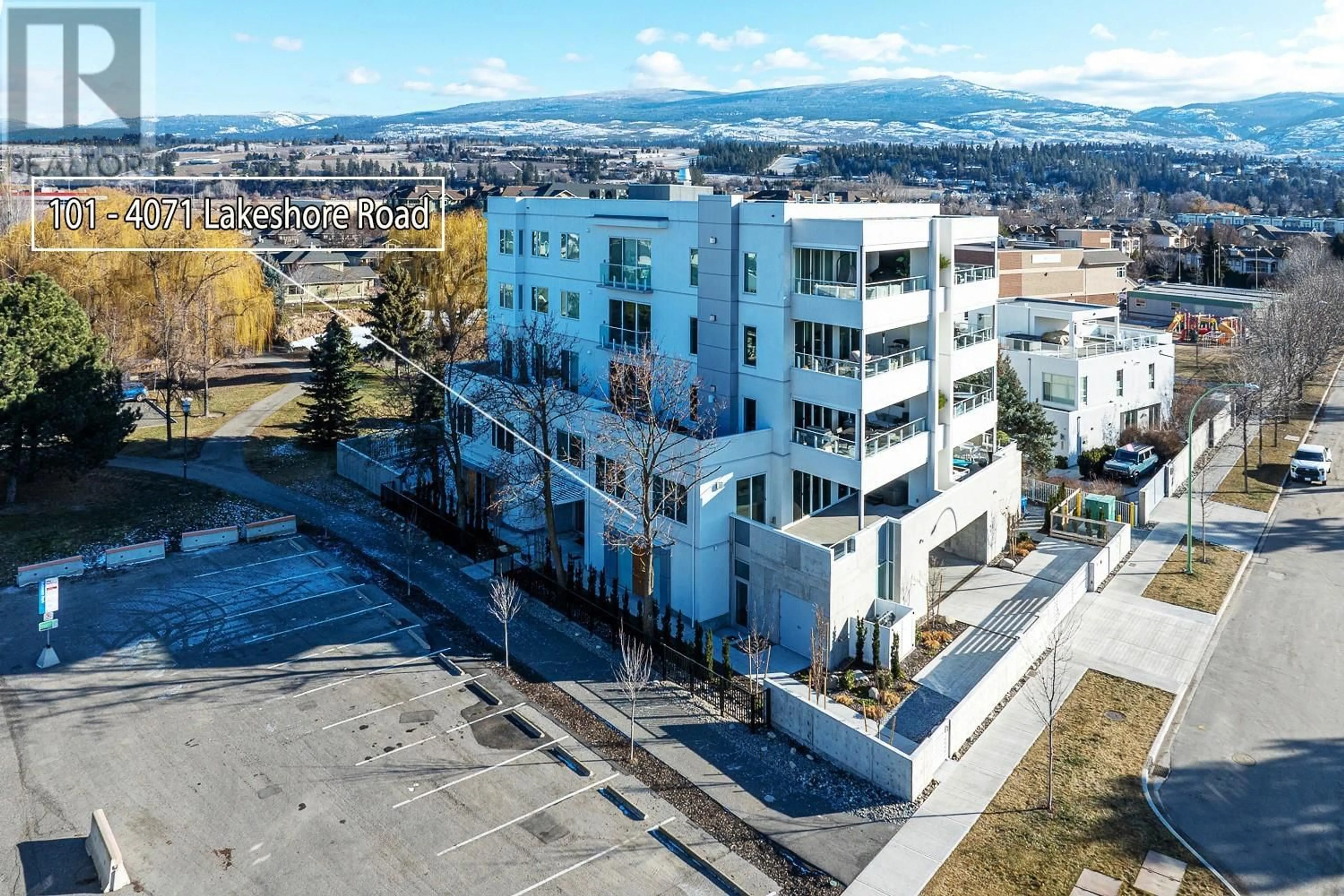 A pic from outside/outdoor area/front of a property/back of a property/a pic from drone, unknown for 101 - 4071 LAKESHORE ROAD, Kelowna British Columbia V1W1V7