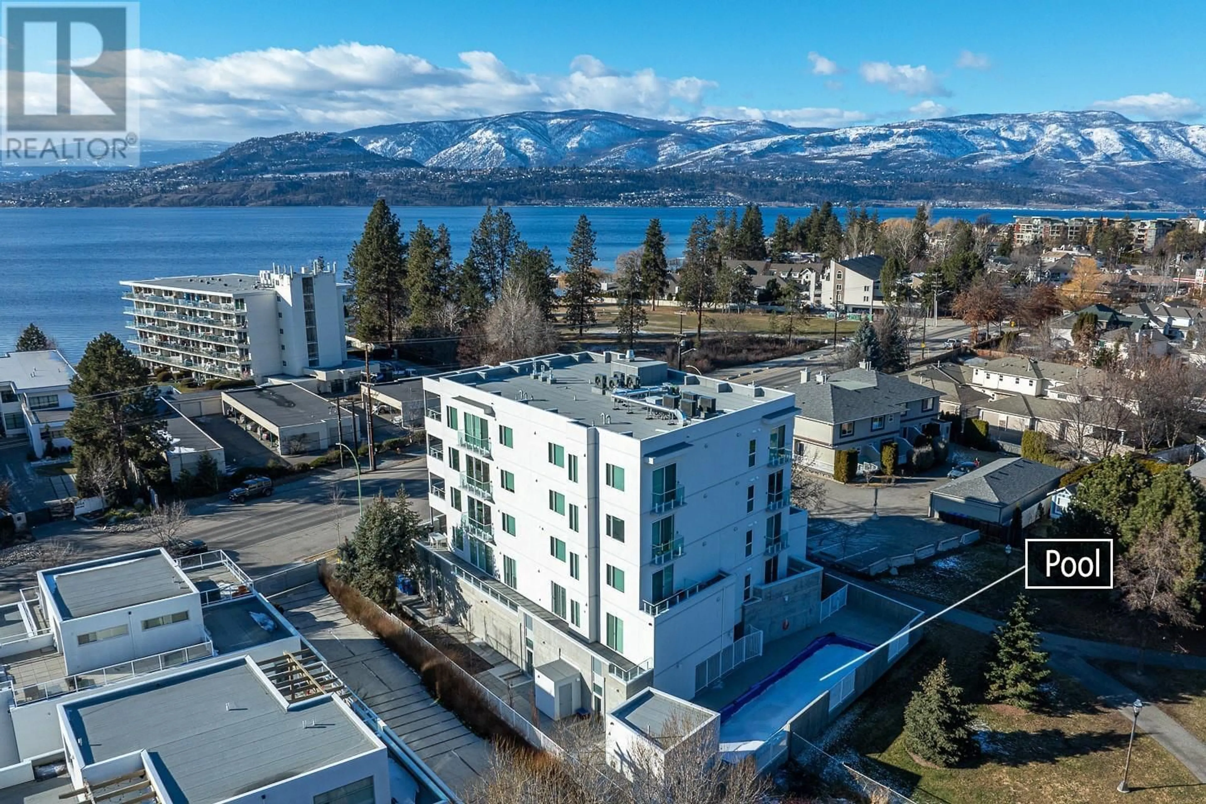 A pic from outside/outdoor area/front of a property/back of a property/a pic from drone, water/lake/river/ocean view for 4071 Lakeshore Road Unit# 101, Kelowna British Columbia V1W1V7