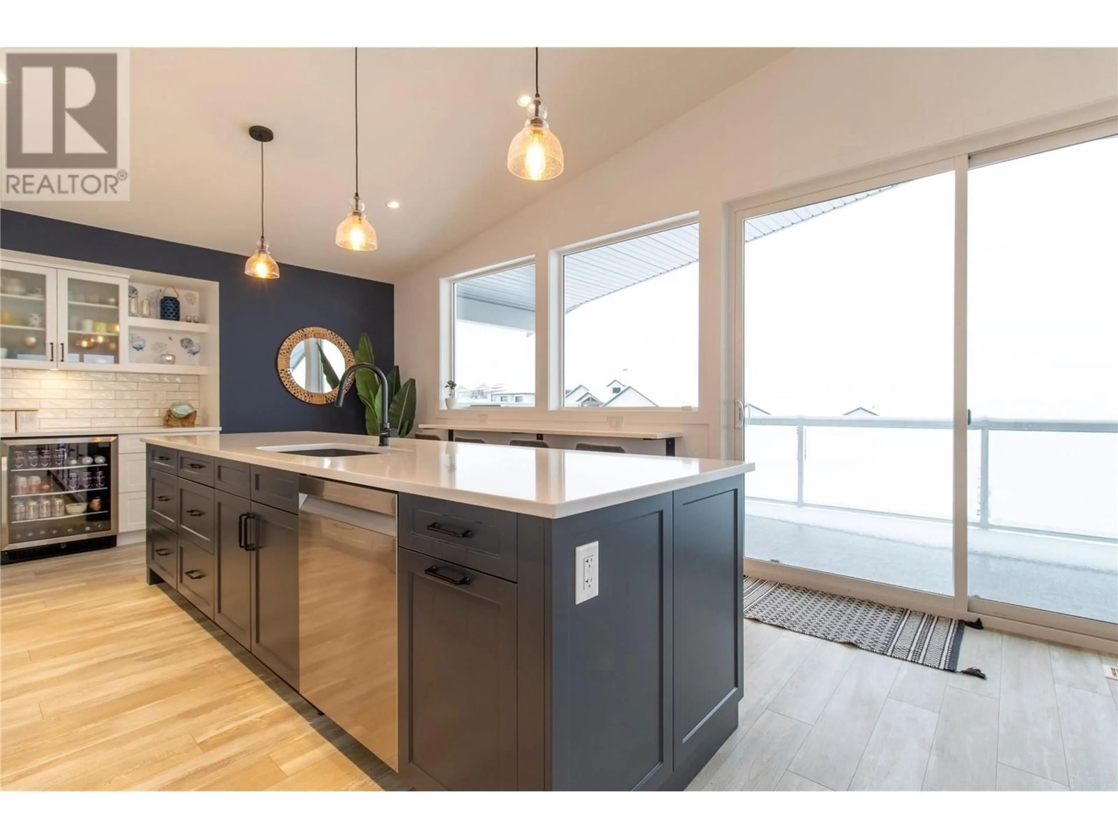 Open concept kitchen, wood/laminate floor for 2521 Panoramic Way, Blind Bay British Columbia V0E1H0