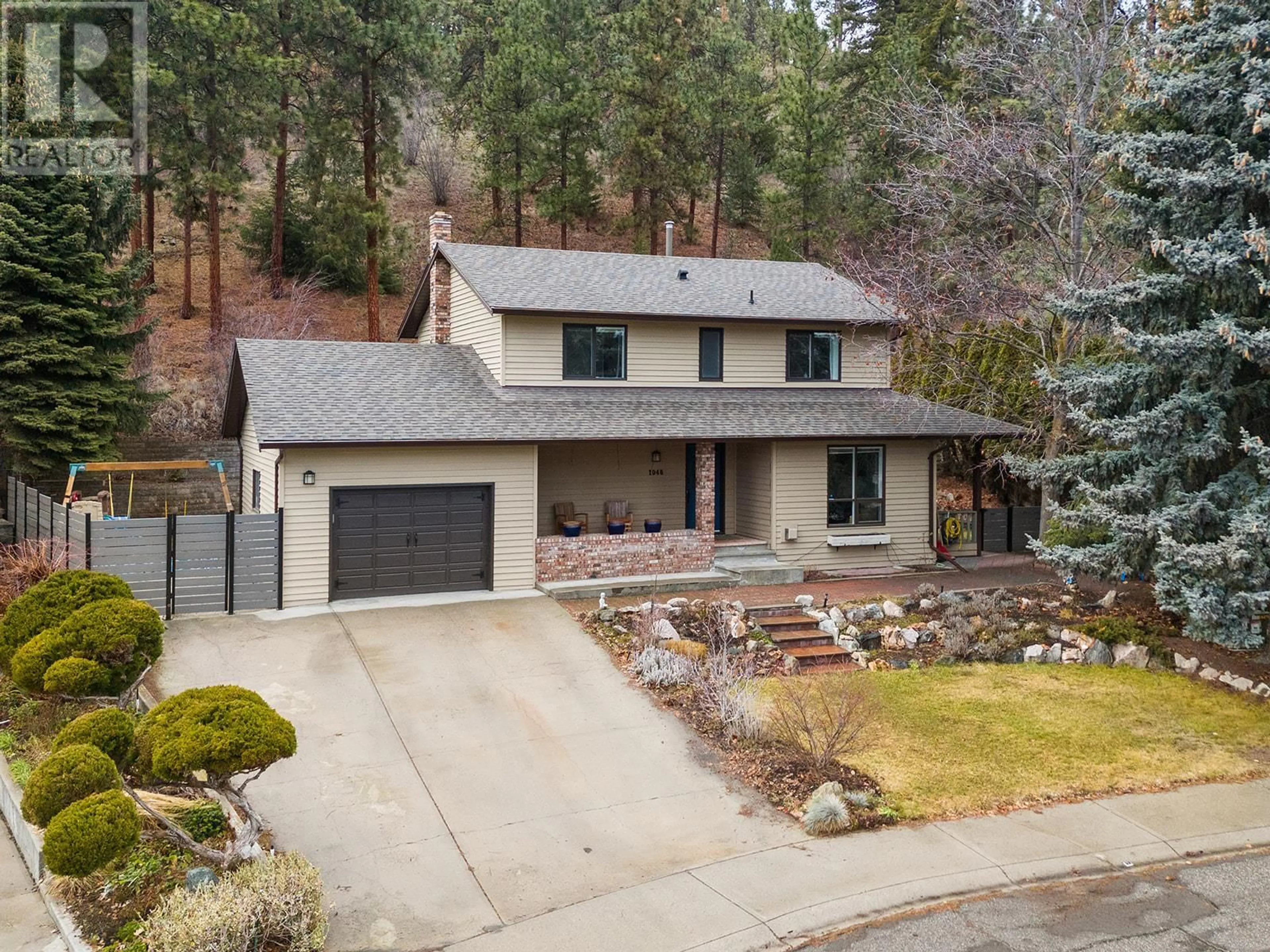 A pic from outside/outdoor area/front of a property/back of a property/a pic from drone, street for 1048 Cascade Place, Kelowna British Columbia V1V1H9