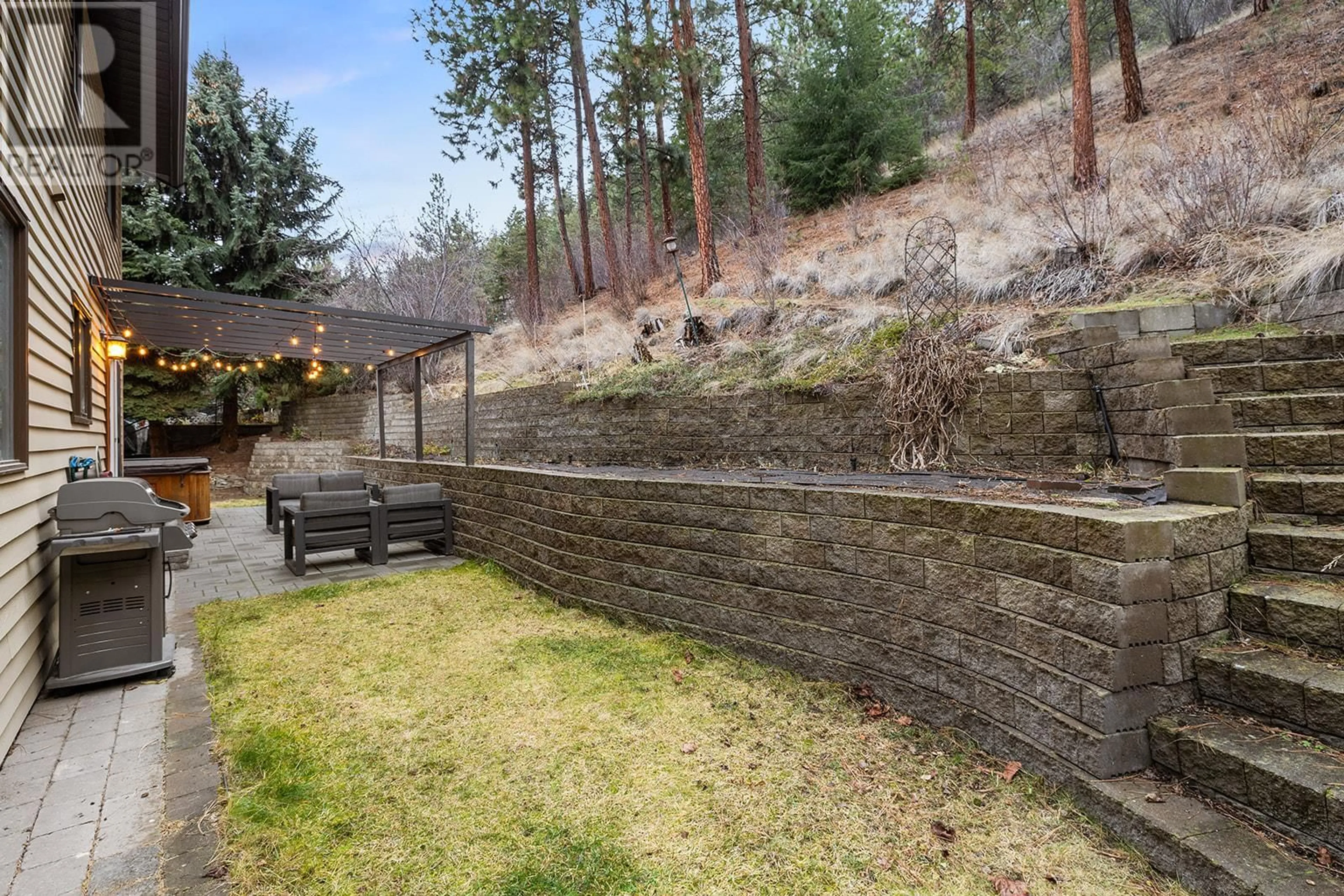 Patio, forest/trees view for 1048 Cascade Place, Kelowna British Columbia V1V1H9