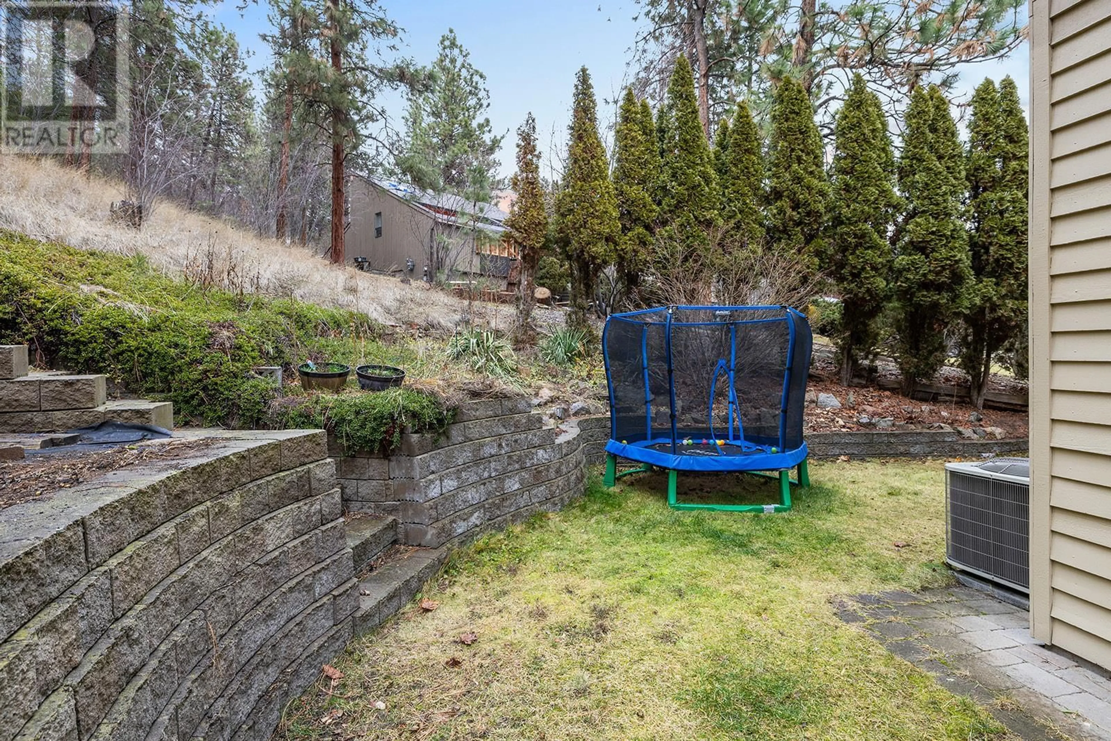 Patio, forest/trees view for 1048 Cascade Place, Kelowna British Columbia V1V1H9