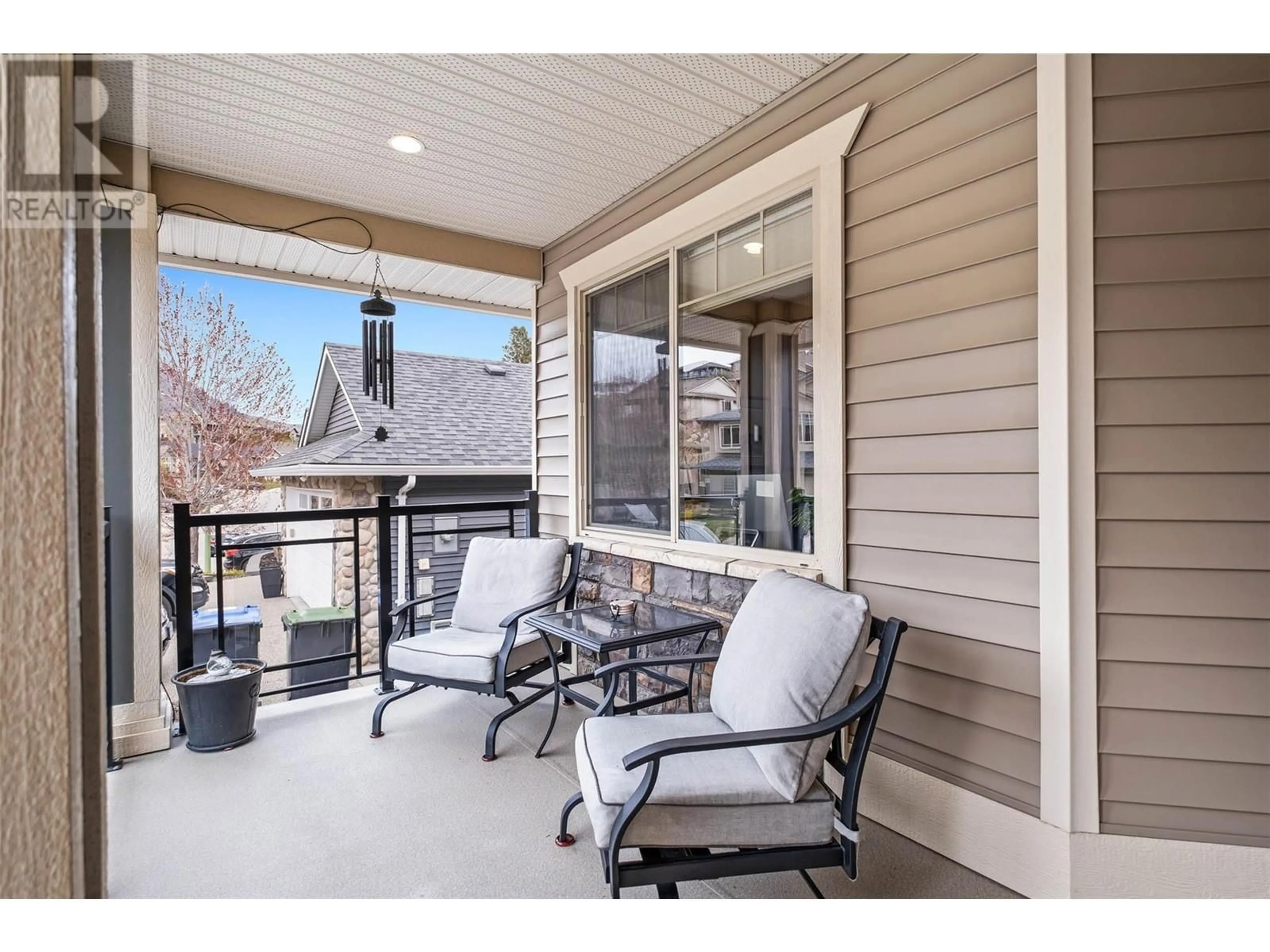 A pic from outside/outdoor area/front of a property/back of a property/a pic from drone, mountain view for 1297 TANEMURA CRESCENT, Kelowna British Columbia V1P1R5