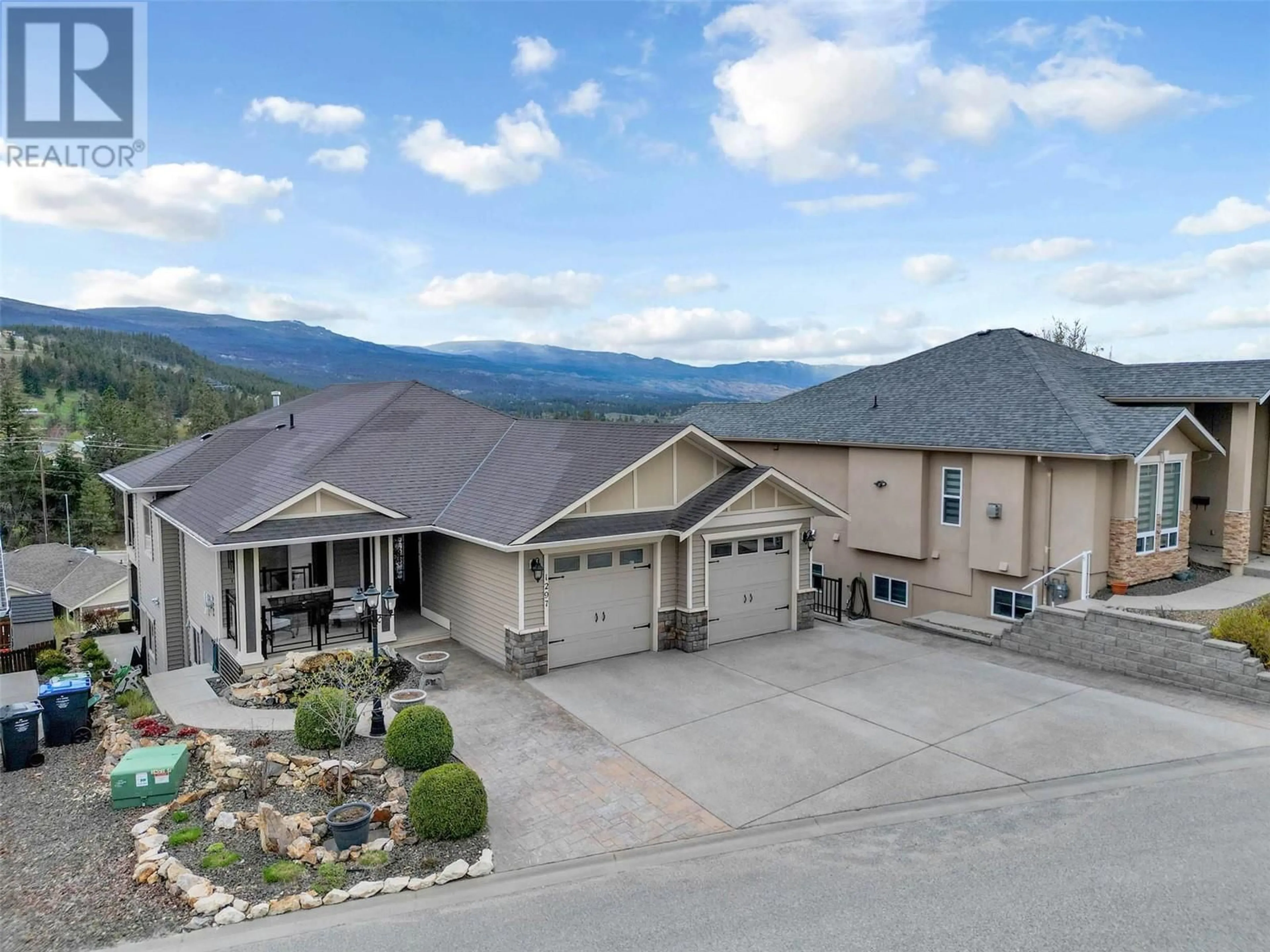 A pic from outside/outdoor area/front of a property/back of a property/a pic from drone, mountain view for 1297 Tanemura Crescent, Kelowna British Columbia V1P1R5