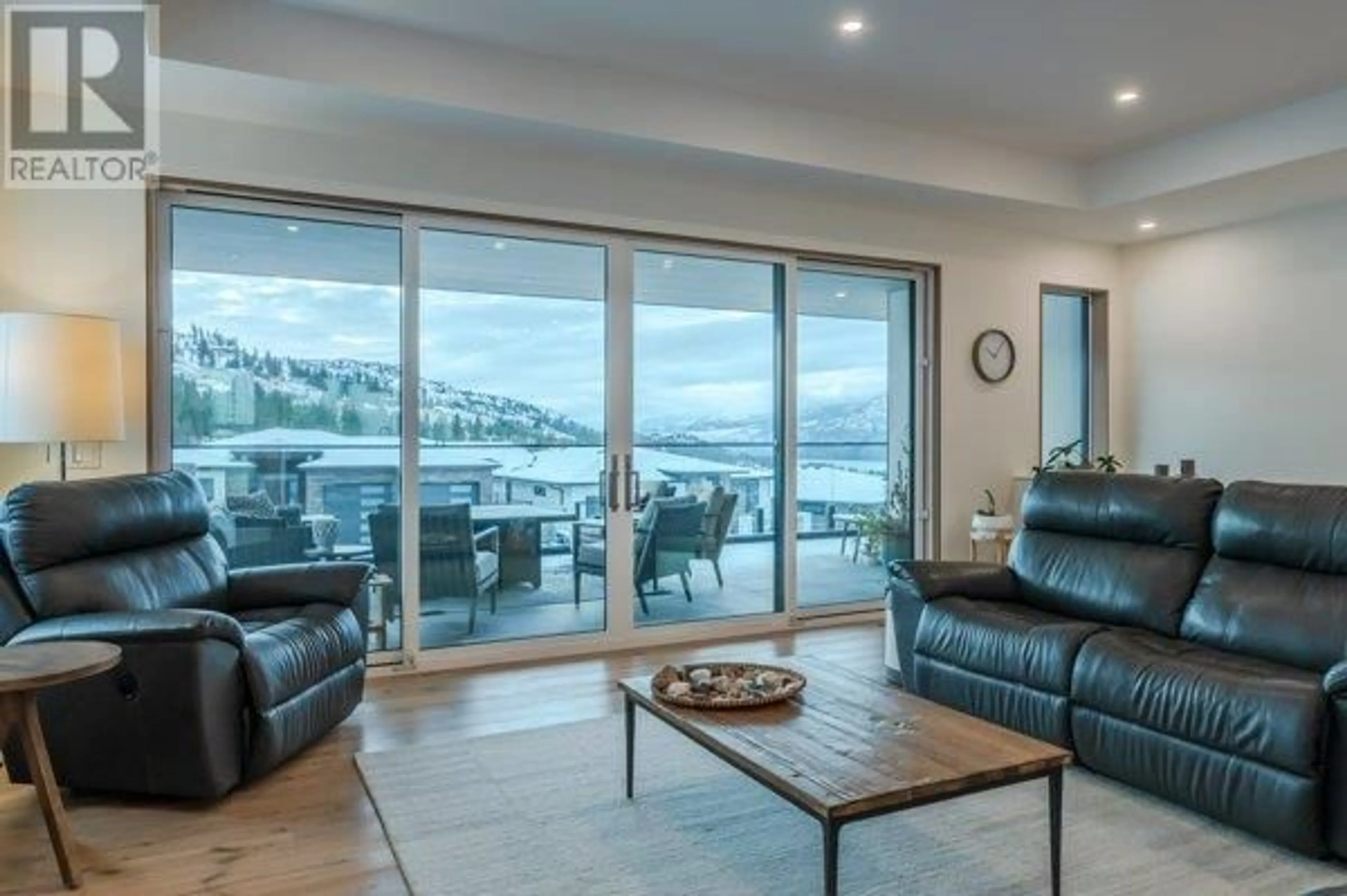 Living room with furniture, wood/laminate floor for 1949 Harris Drive, Penticton British Columbia V2A0C8