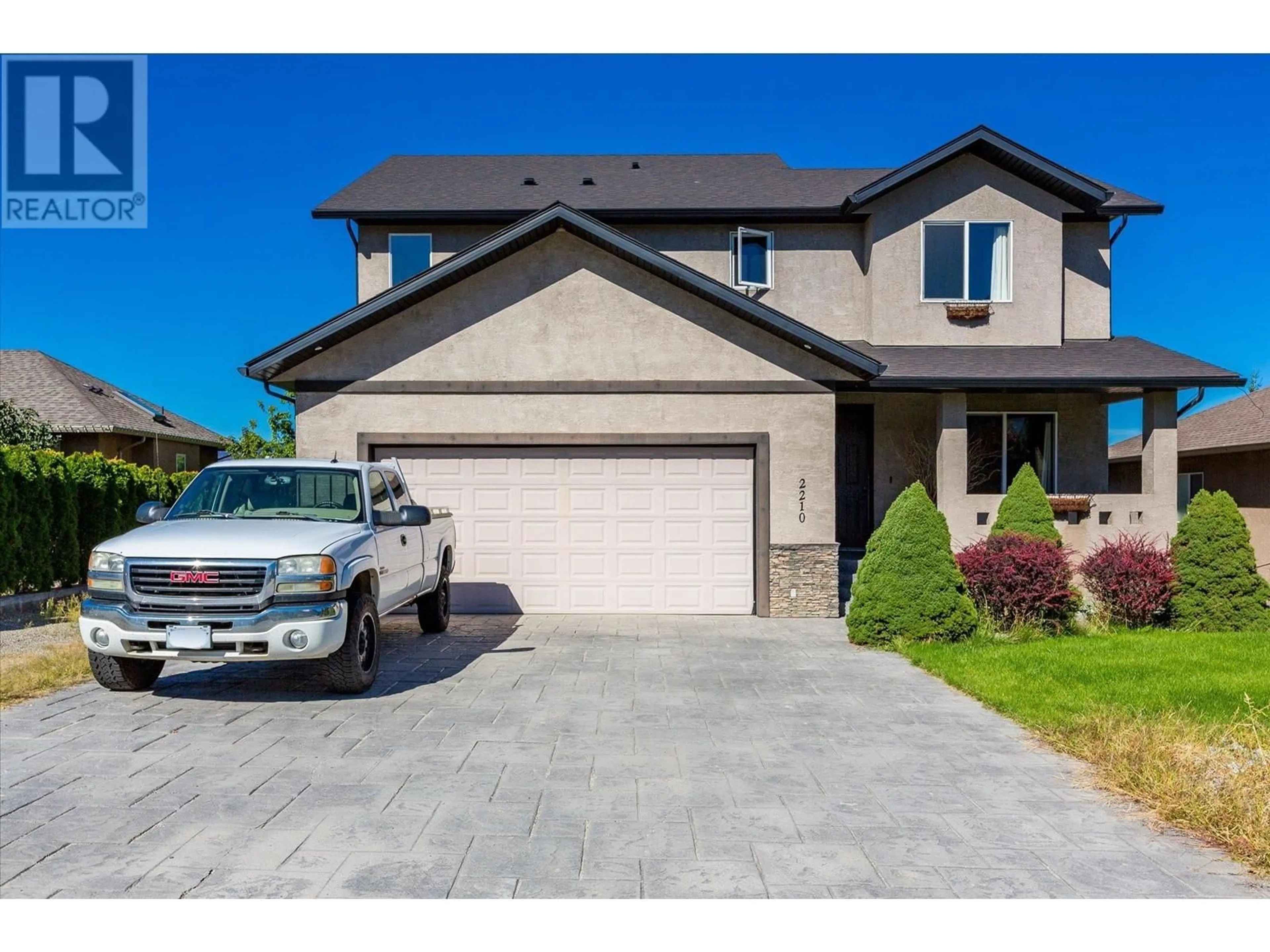 Home with brick exterior material, street for 2210 Quail Run Drive, Kelowna British Columbia V1V2S4