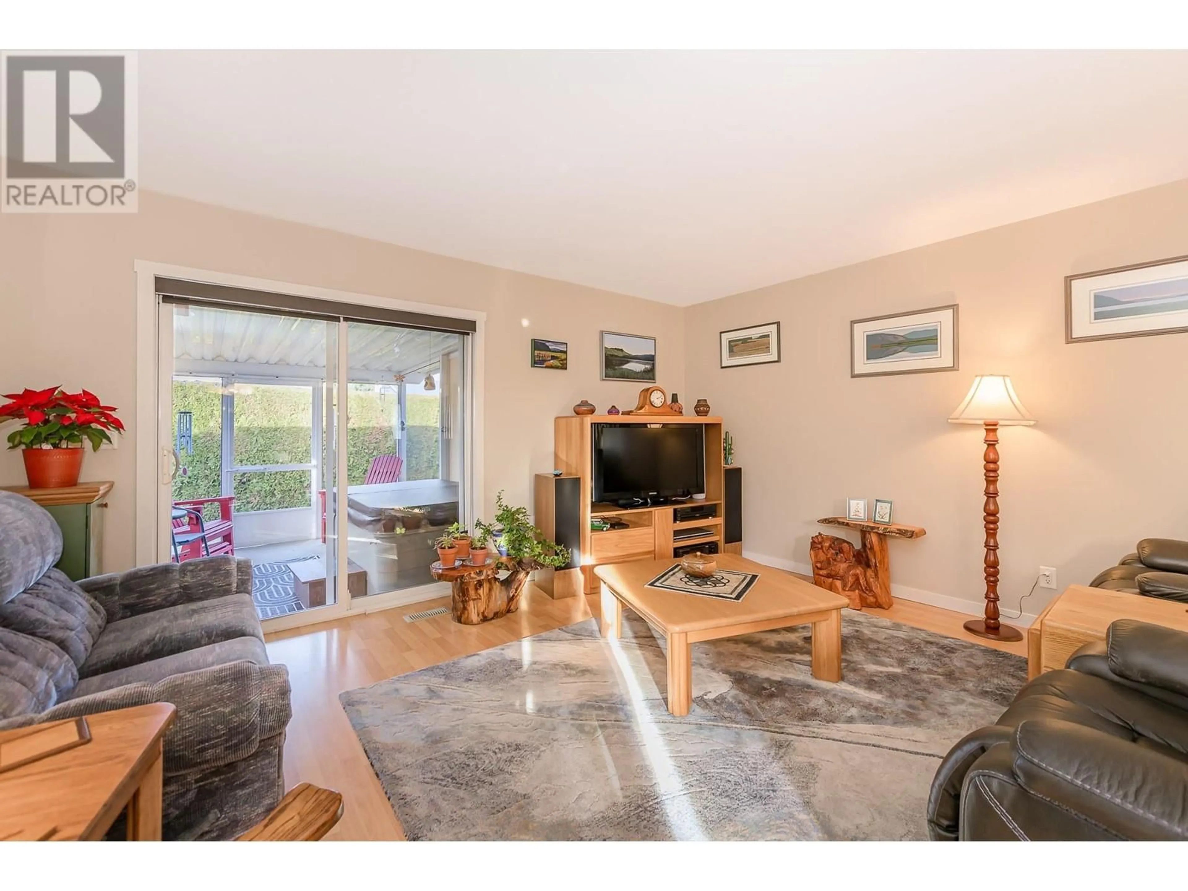 Living room with furniture, wood/laminate floor for 201 Kildonan Avenue Unit# 14, Enderby British Columbia V0E1V2