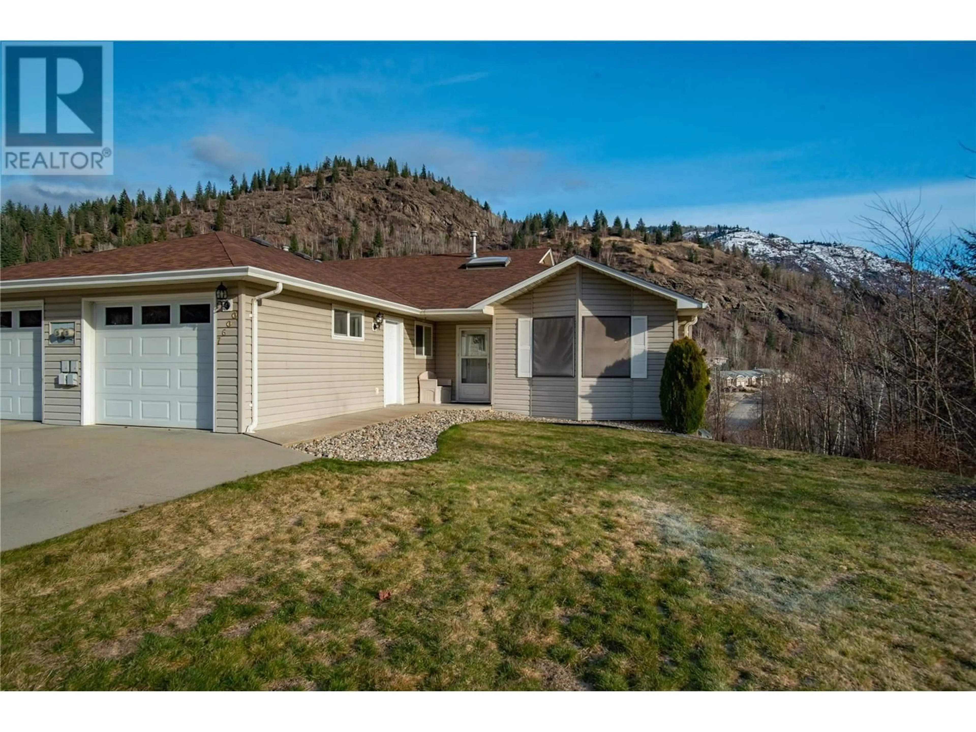 Home with vinyl exterior material, mountain view for 7600 Crema Drive, Trail British Columbia V1R2Y8