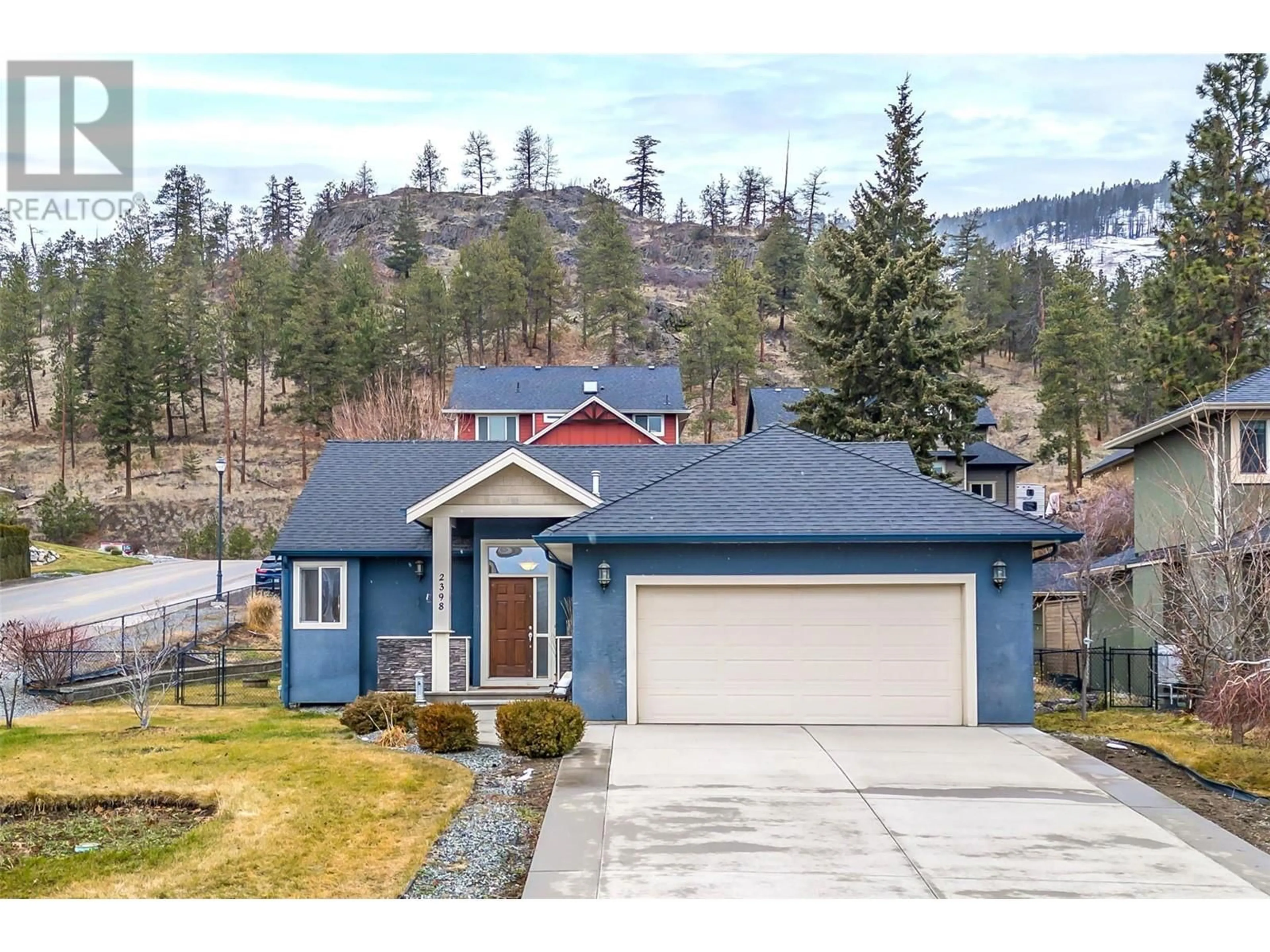 Home with vinyl exterior material, street for 2398 Cobblestone Road, West Kelowna British Columbia V4T3A7