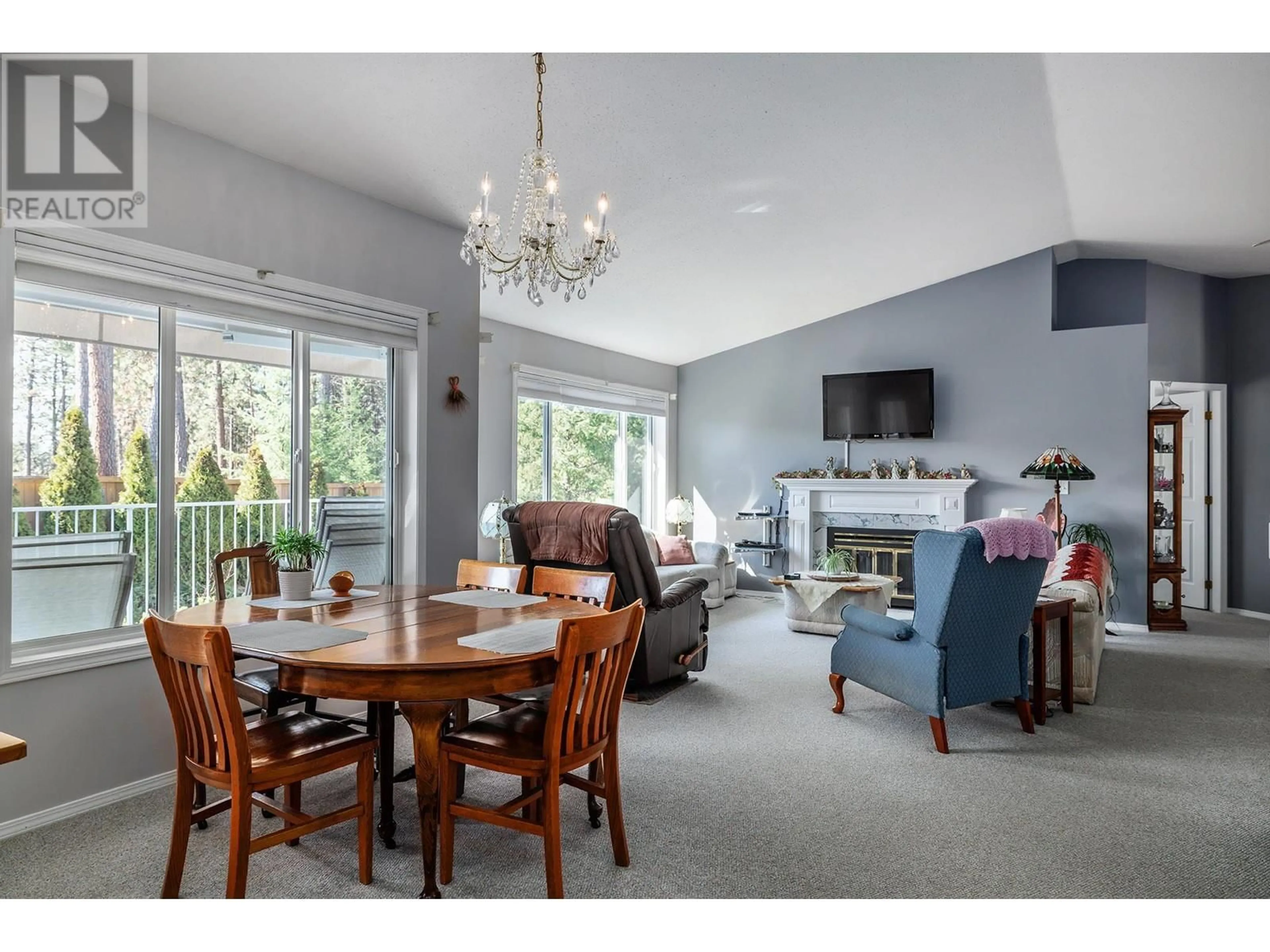 Living room with furniture, wood/laminate floor for 11290 Bond Road Unit# 6, Lake Country British Columbia V4V1E1