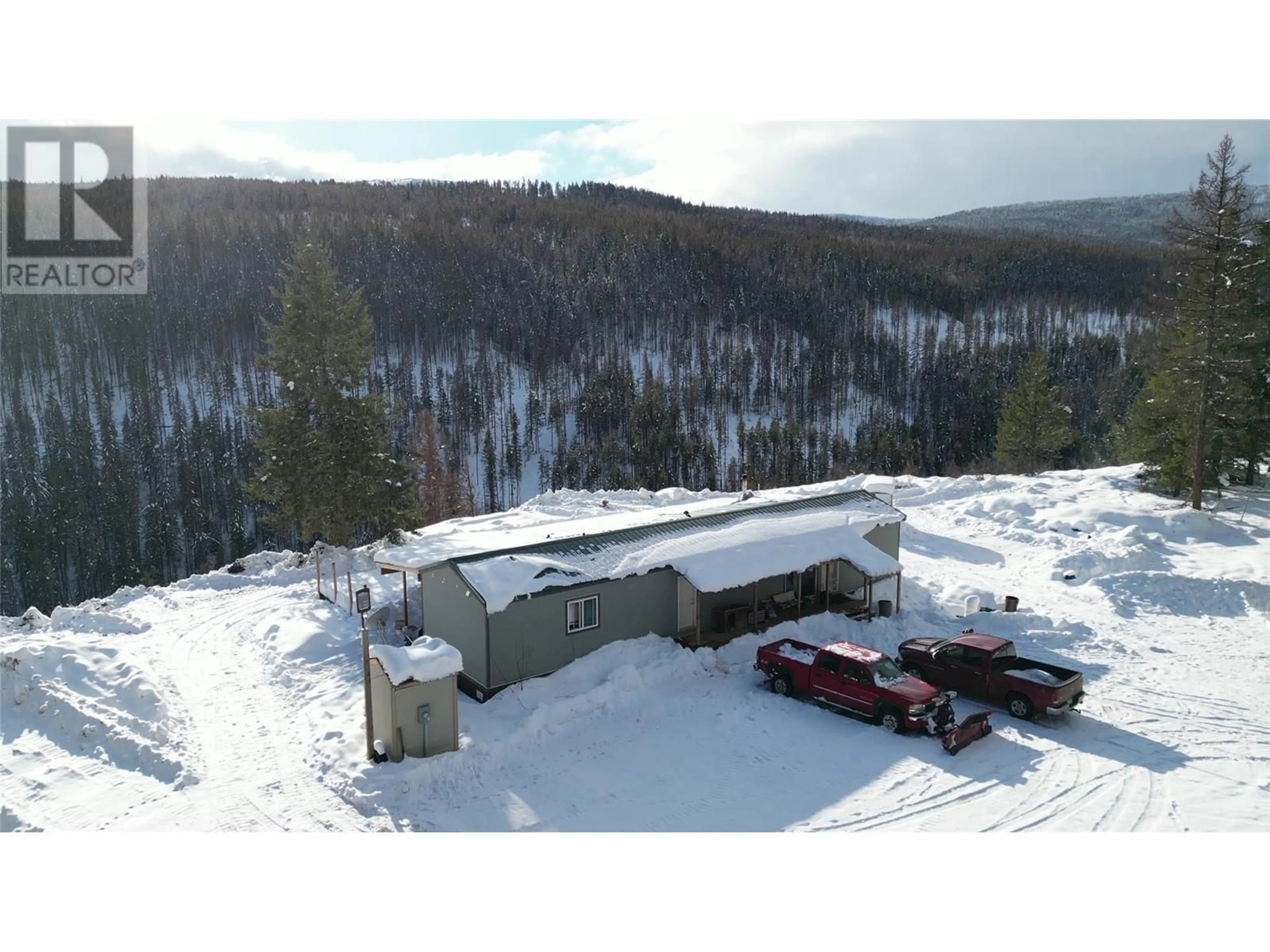 A pic from outside/outdoor area/front of a property/back of a property/a pic from drone, mountain view for 5630 Burton Road, Bridesville British Columbia V0H1Y0