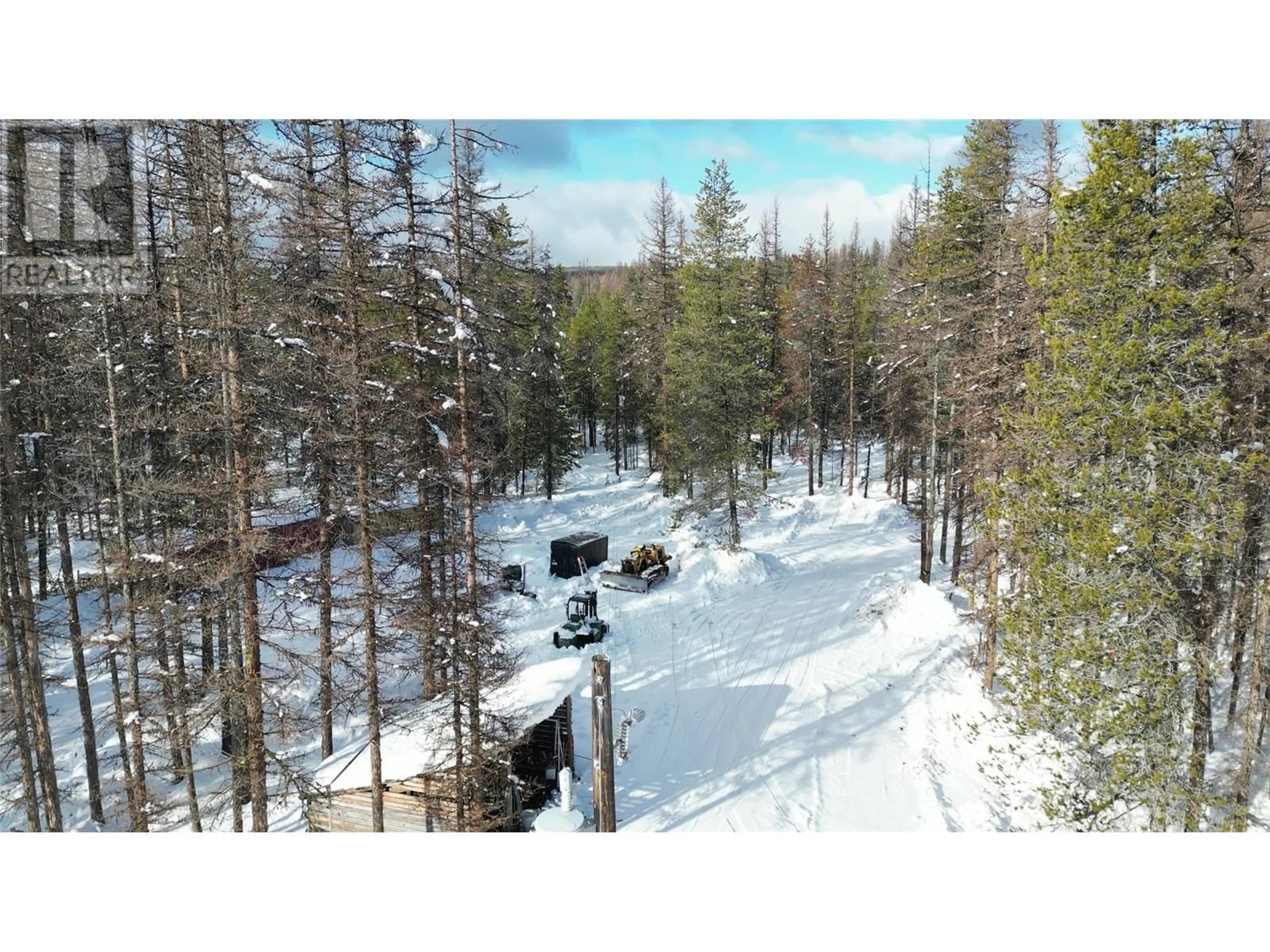 A pic from outside/outdoor area/front of a property/back of a property/a pic from drone, forest/trees view for 5630 Burton Road, Bridesville British Columbia V0H1Y0