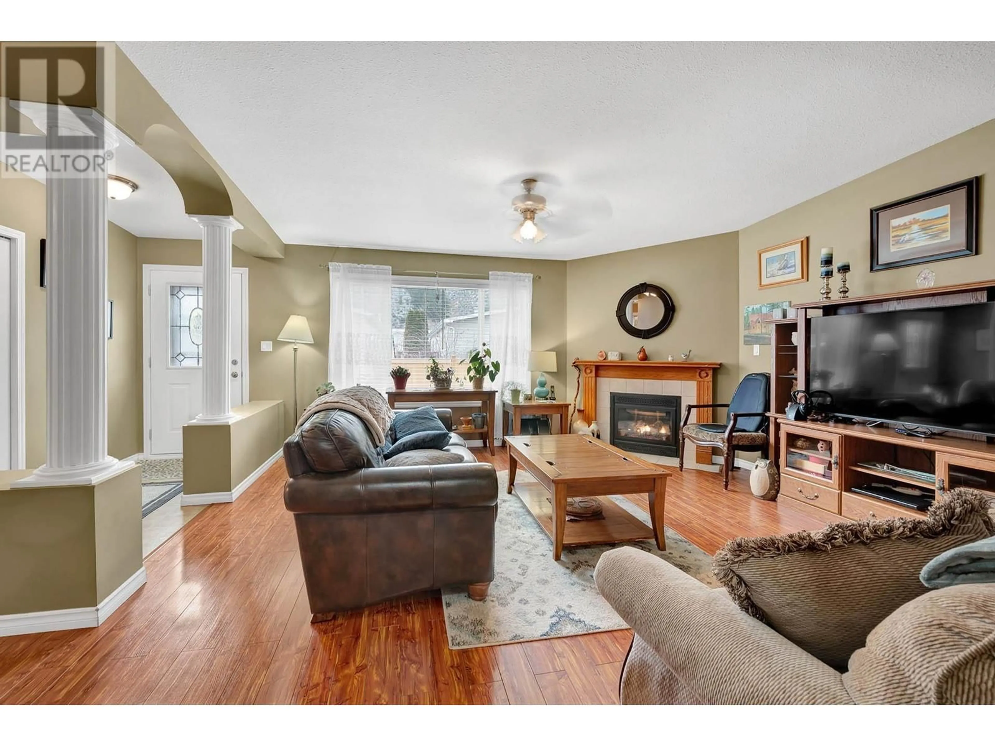 Living room with furniture, wood/laminate floor for 7545 Dallas Drive Unit# 89, Kamloops British Columbia V2C6X9