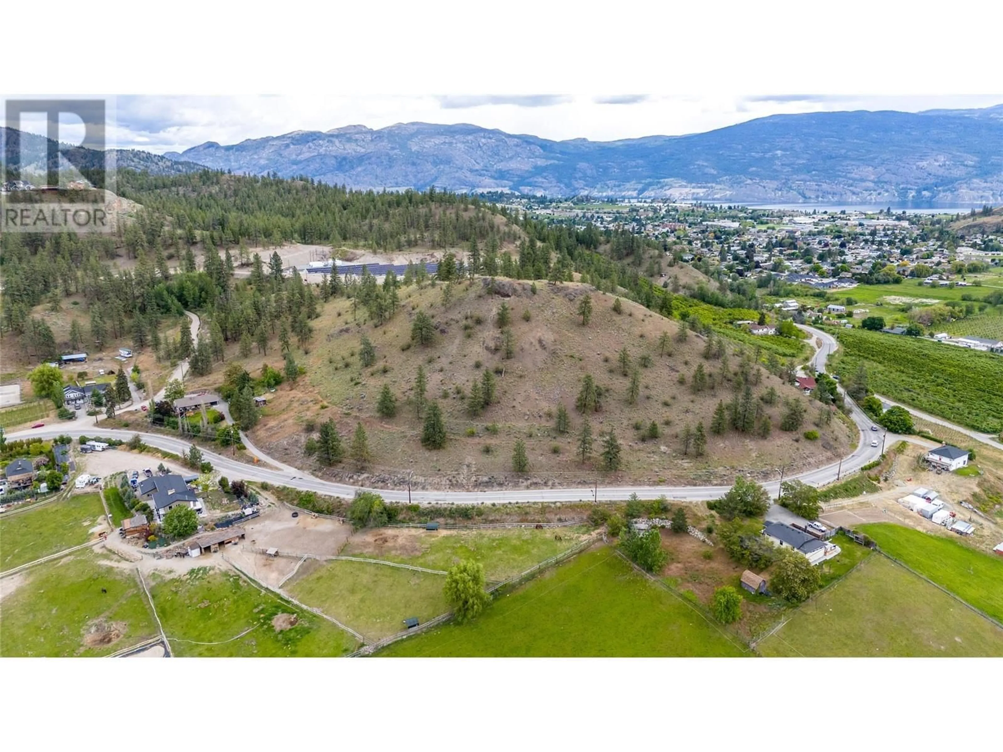 A pic from outside/outdoor area/front of a property/back of a property/a pic from drone, mountain view for 13316 Prairie Valley Road, Summerland British Columbia V0H1Z8