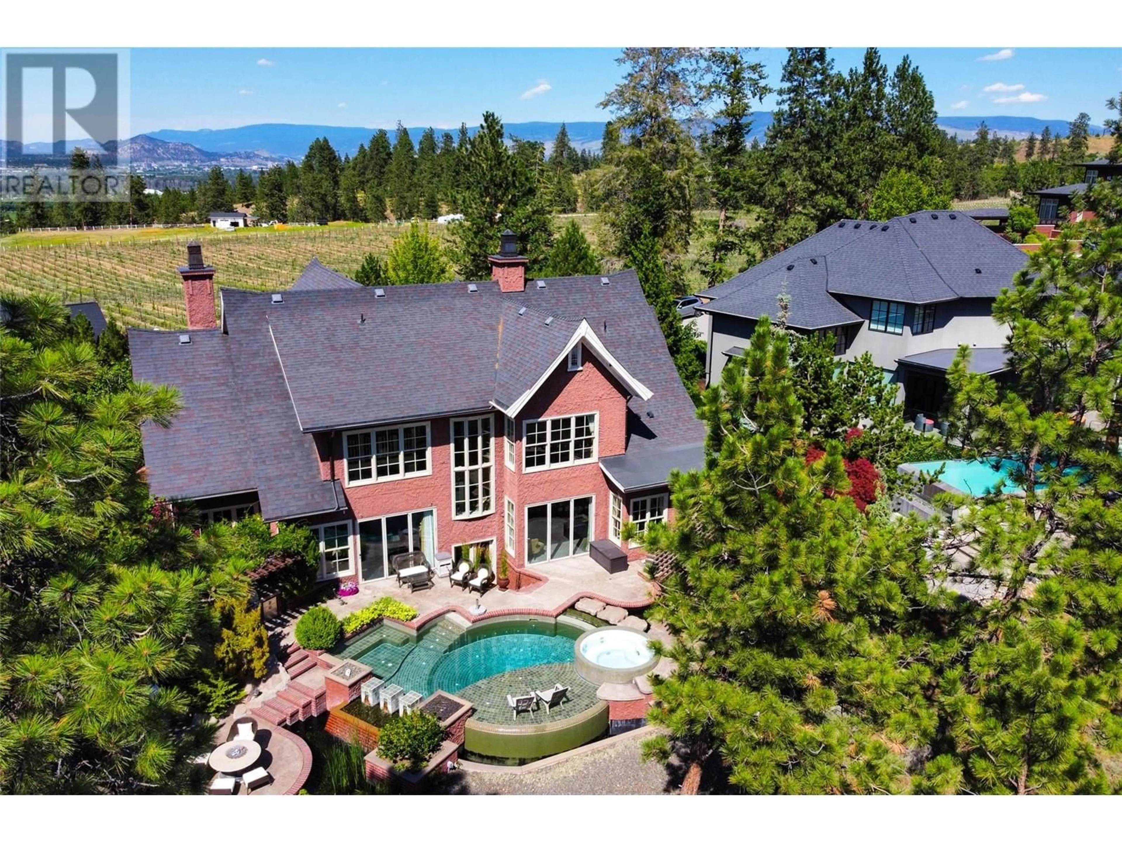 A pic from outside/outdoor area/front of a property/back of a property/a pic from drone, mountain view for 965 Westpoint Drive, Kelowna British Columbia V1W2Z3