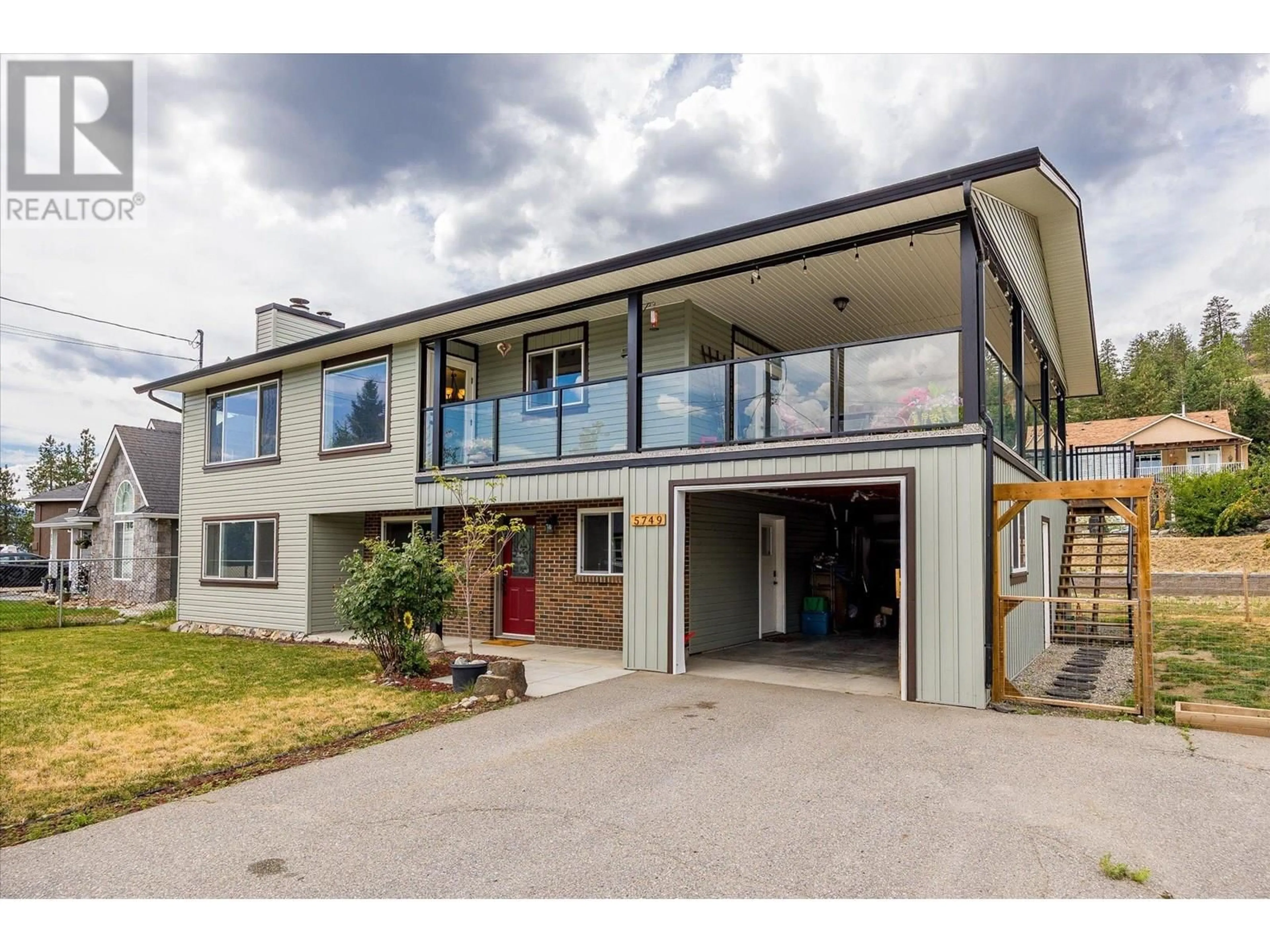 A pic from outside/outdoor area/front of a property/back of a property/a pic from drone, building for 5749 MACKENZIE ROAD, Peachland British Columbia V0H1X4