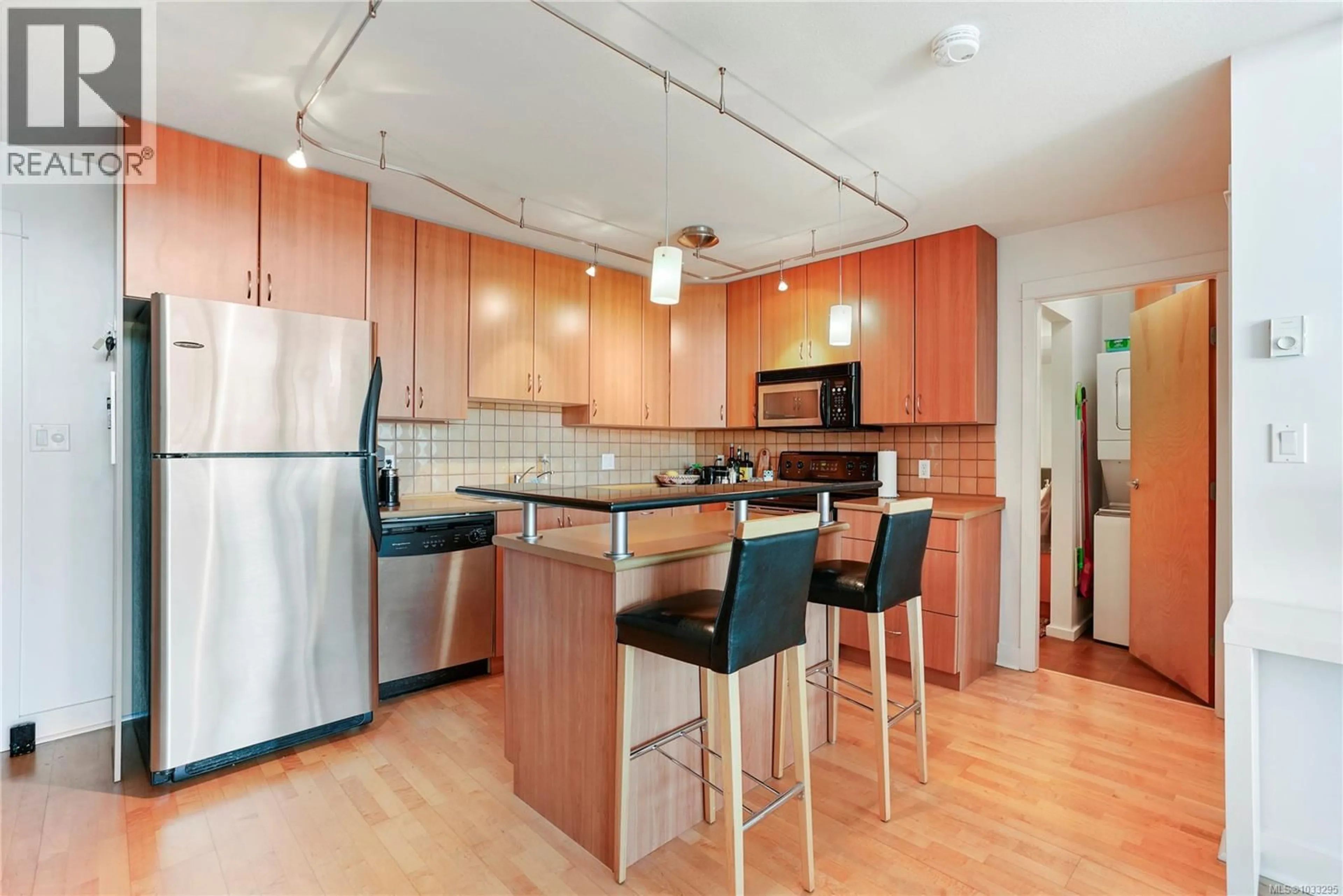 Open concept kitchen, wood/laminate floor for 402 - 1155 YATES STREET, Victoria British Columbia V8V3N1