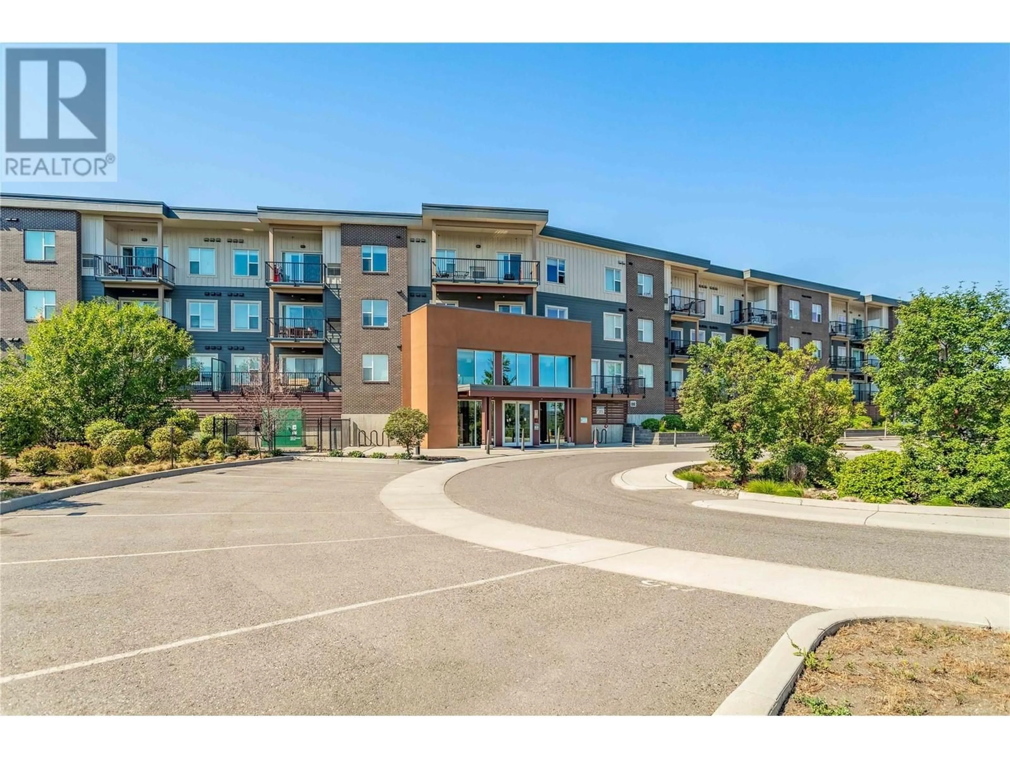 A pic from outside/outdoor area/front of a property/back of a property/a pic from drone, unknown for 319 - 935 ACADEMY WAY, Kelowna British Columbia V1V3C9