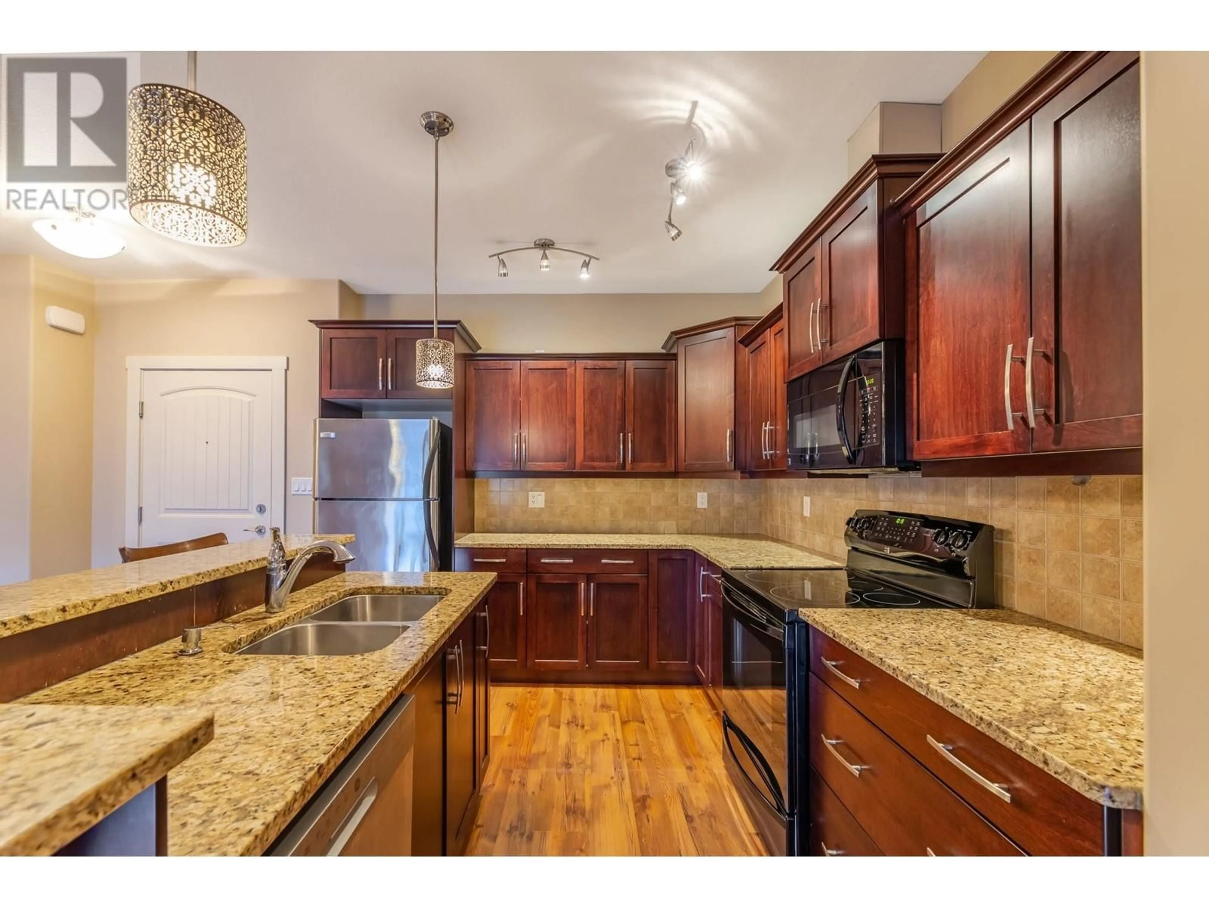 Open concept kitchen, unknown for 13615 VICTORIA Road Unit# 313, Summerland British Columbia V0H1Z2