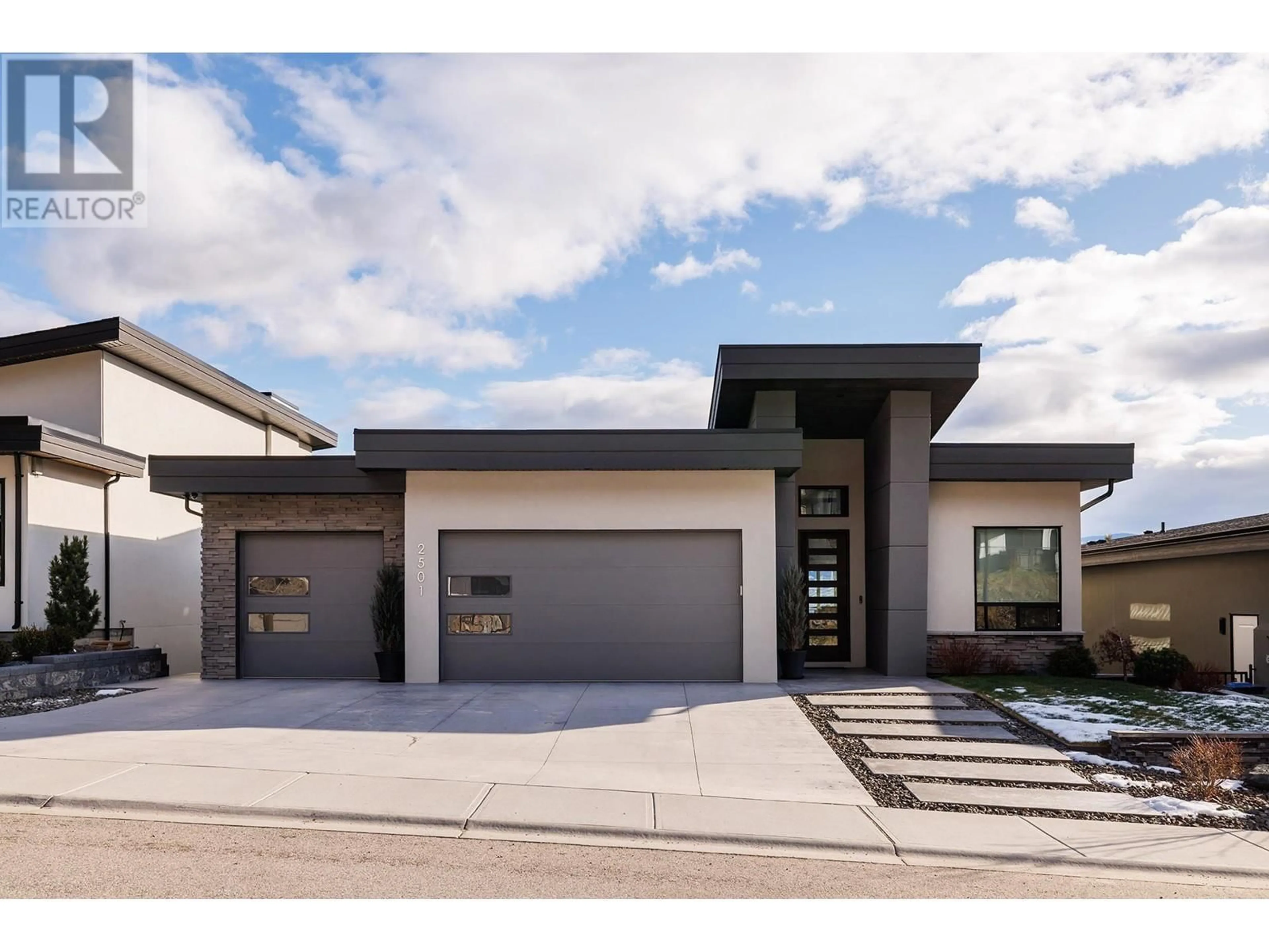 Home with brick exterior material, street for 2501 Tallus Heights Drive, West Kelowna British Columbia V4T3M2