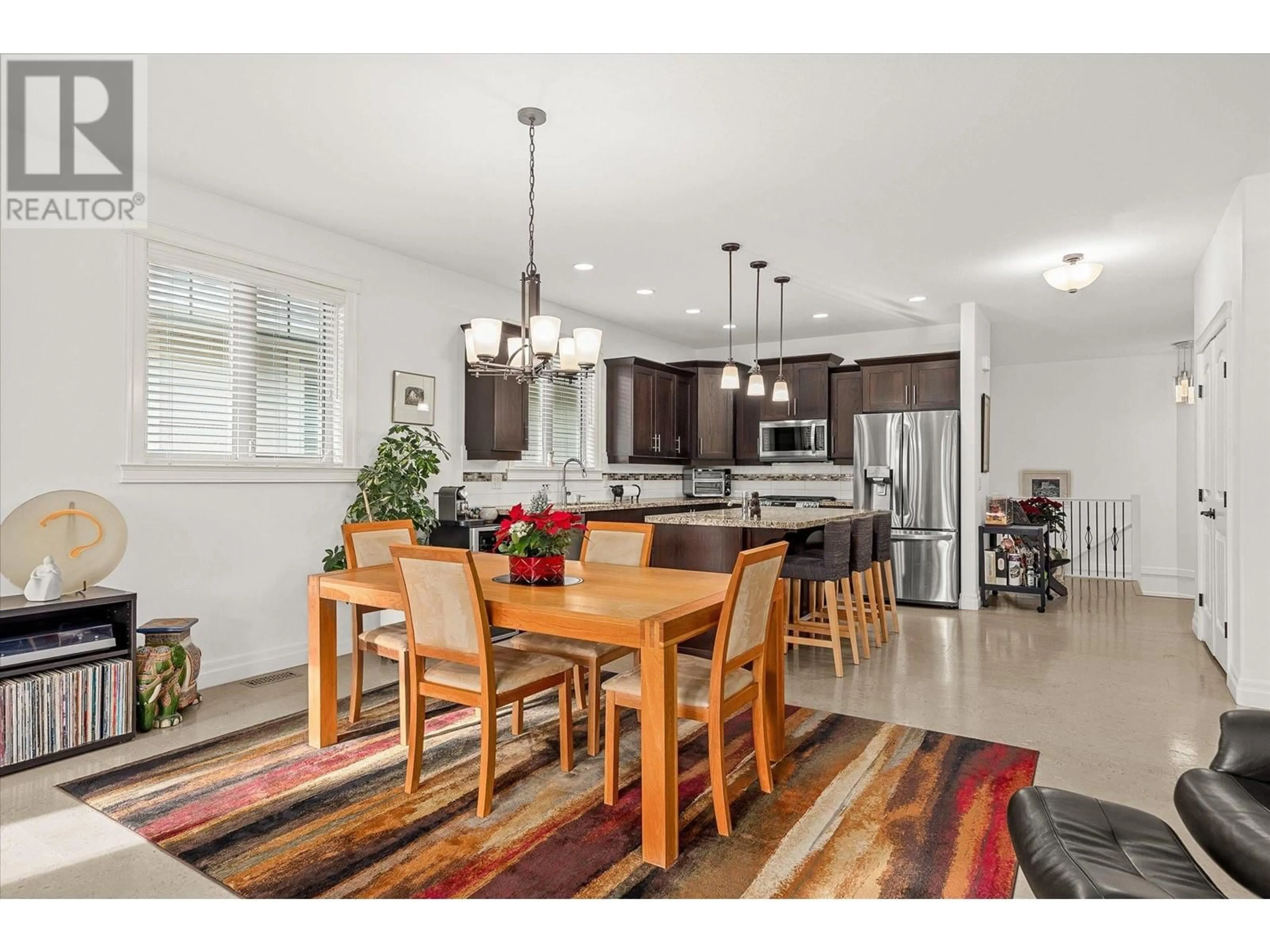 Open concept kitchen, wood/laminate floor for 2283 Shannon Heights Court Unit# 14, West Kelowna British Columbia V4T3B9