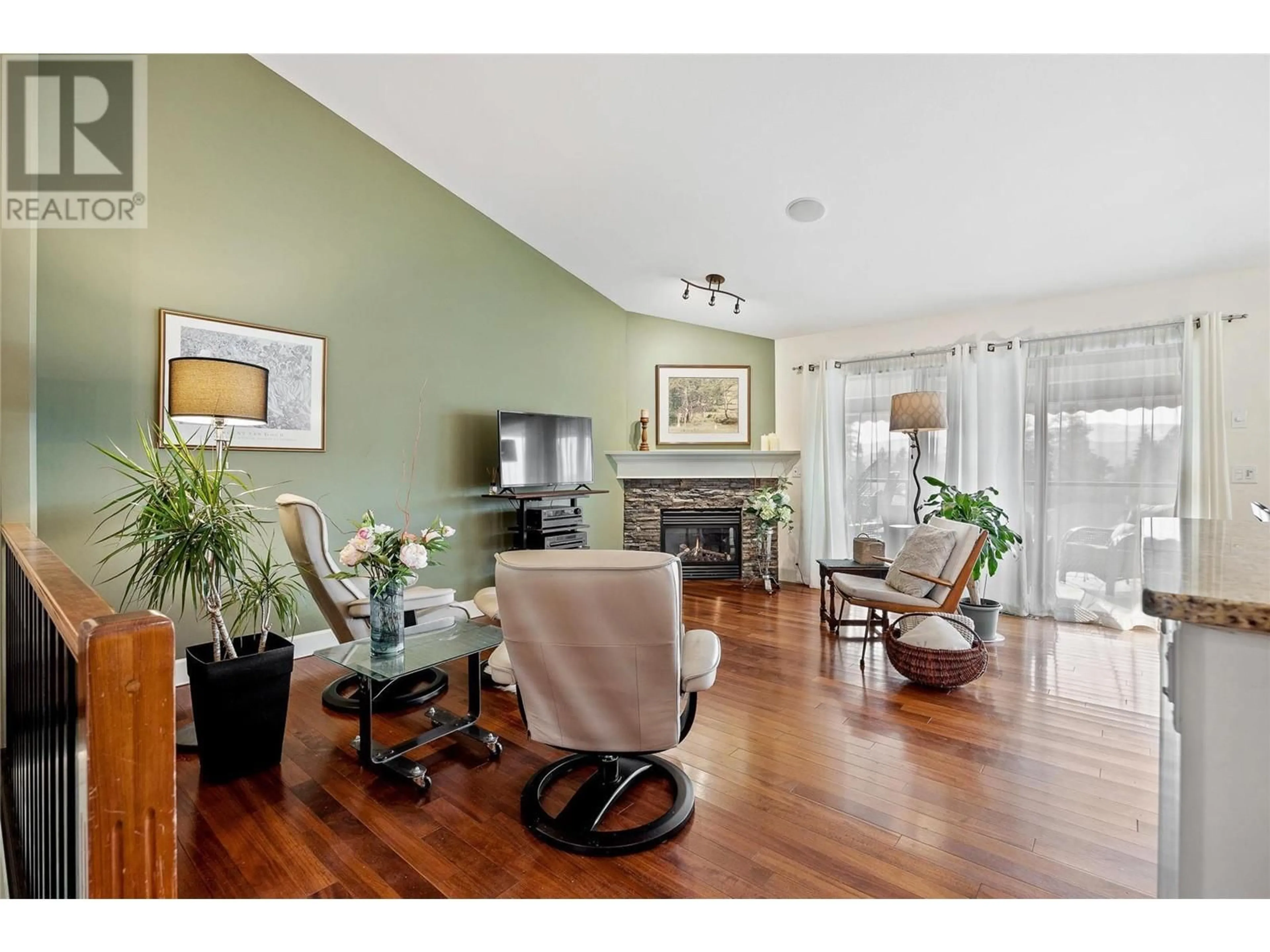 Living room with furniture, wood/laminate floor for 3602 SHADOW CREEK DRIVE, Kelowna British Columbia V1X8A7