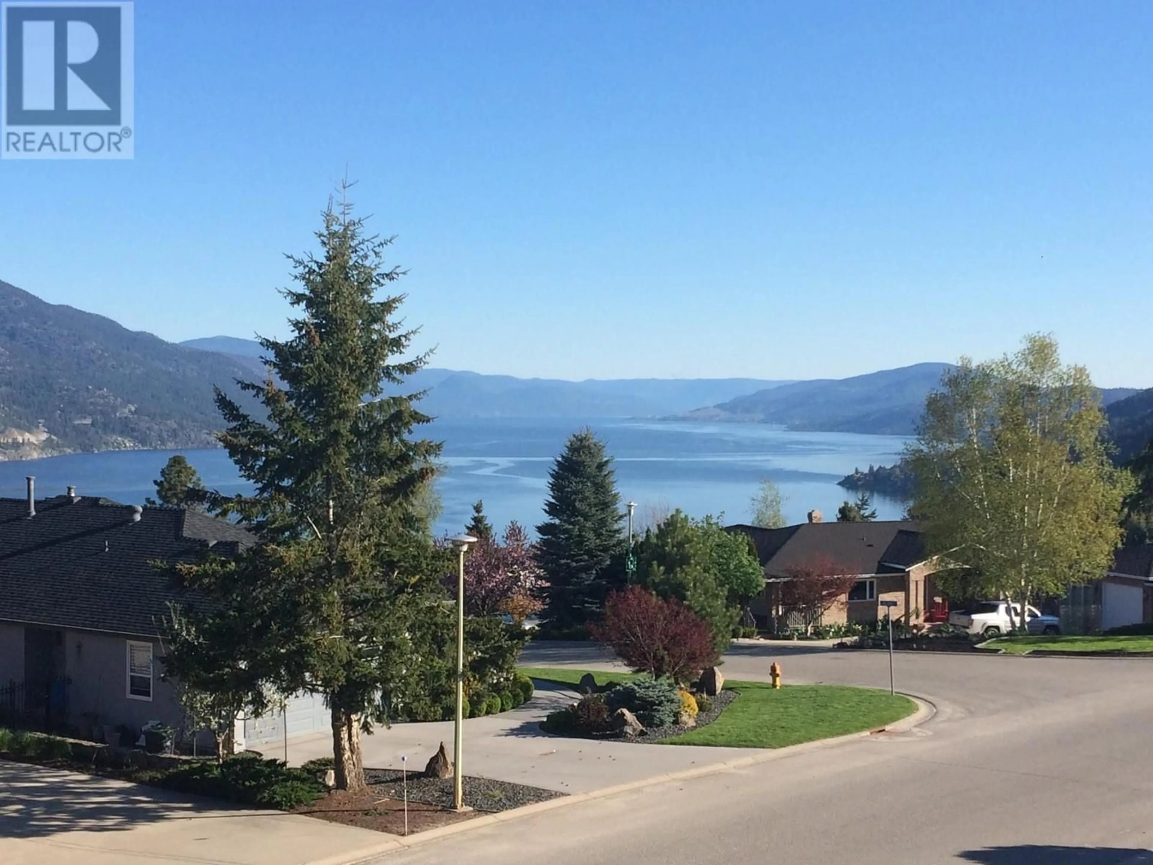 A pic from outside/outdoor area/front of a property/back of a property/a pic from drone, water/lake/river/ocean view for 183 Magic Drive, Kelowna British Columbia V1V1N2