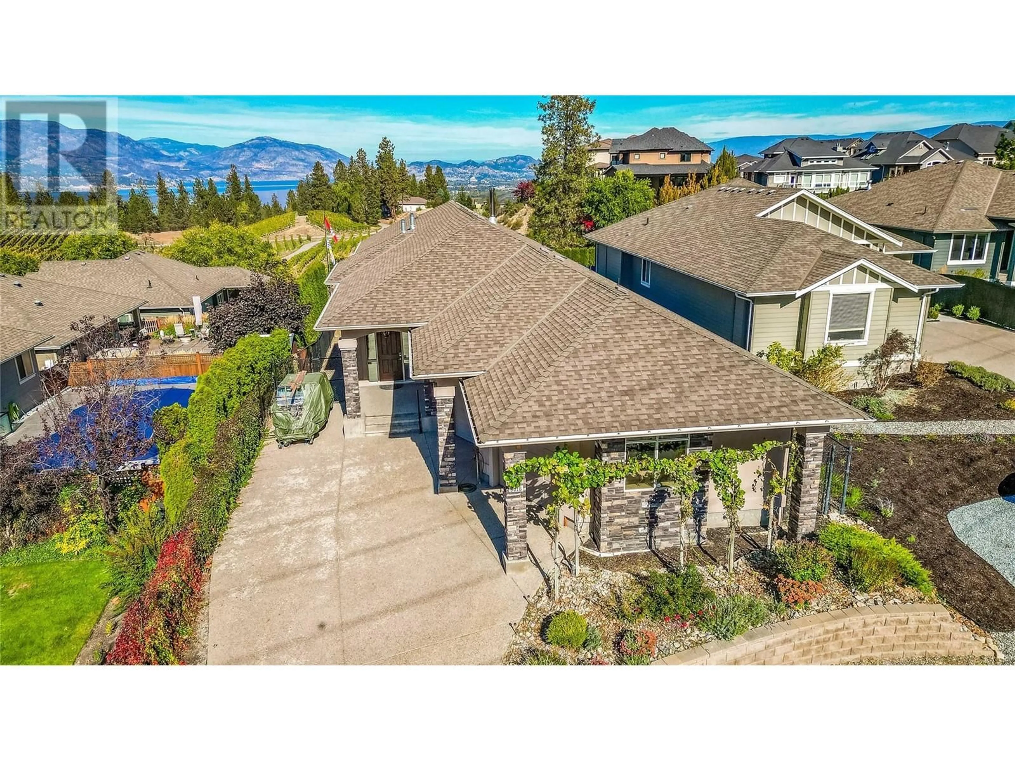 A pic from outside/outdoor area/front of a property/back of a property/a pic from drone, mountain view for 5016 Seon Crescent, Kelowna British Columbia V1W5G6