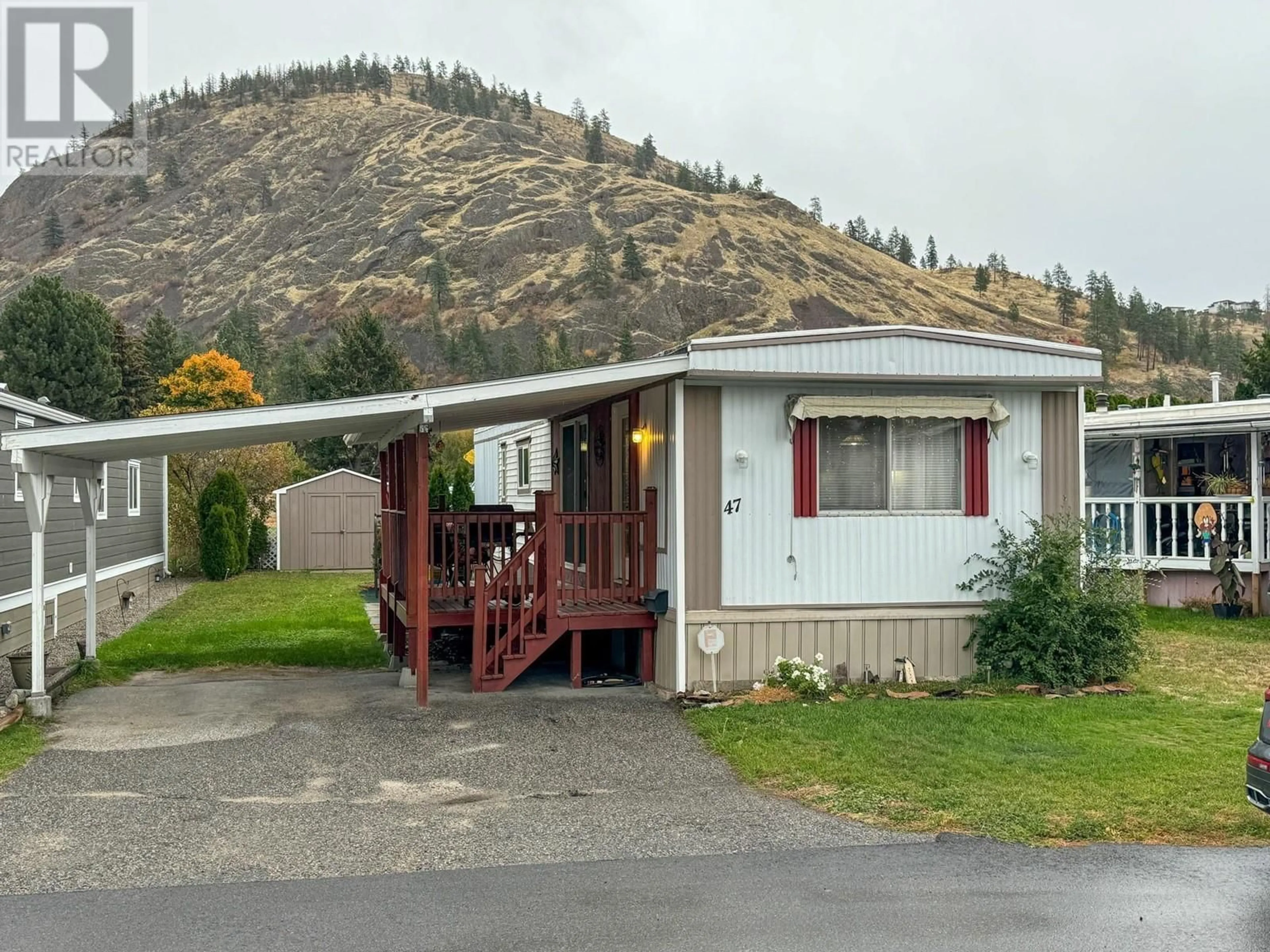 Home with vinyl exterior material, mountain view for 1929 Highway 97 S Street Unit# 47, West Kelowna British Columbia V1Z2Z1