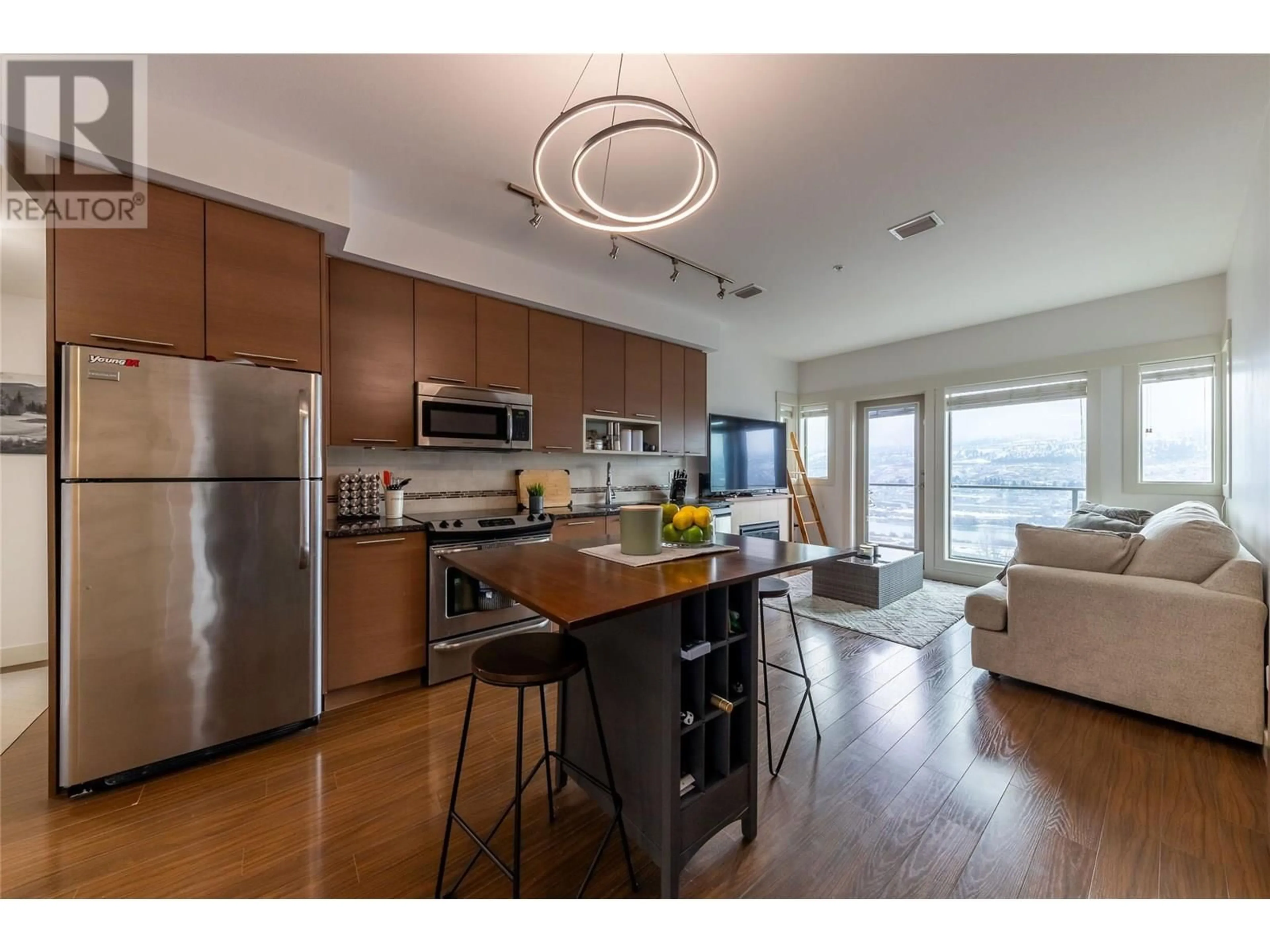 Open concept kitchen, wood/laminate floor for 2317 - 1030 TALASA WAY, Kamloops British Columbia V2H0C3