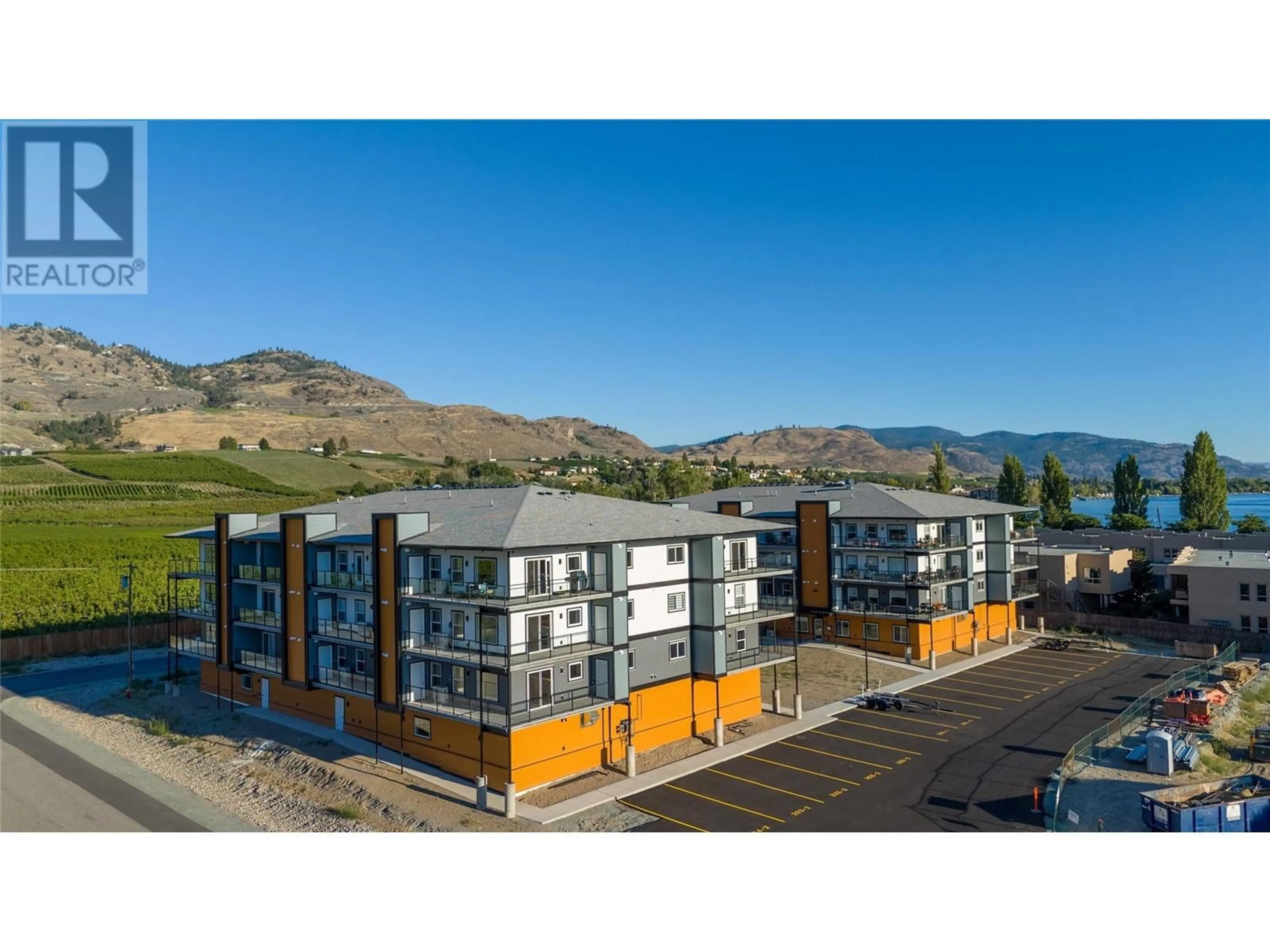 A pic from outside/outdoor area/front of a property/back of a property/a pic from drone, mountain view for 5640 51st Street Unit# 203, Osoyoos British Columbia V0H1V6