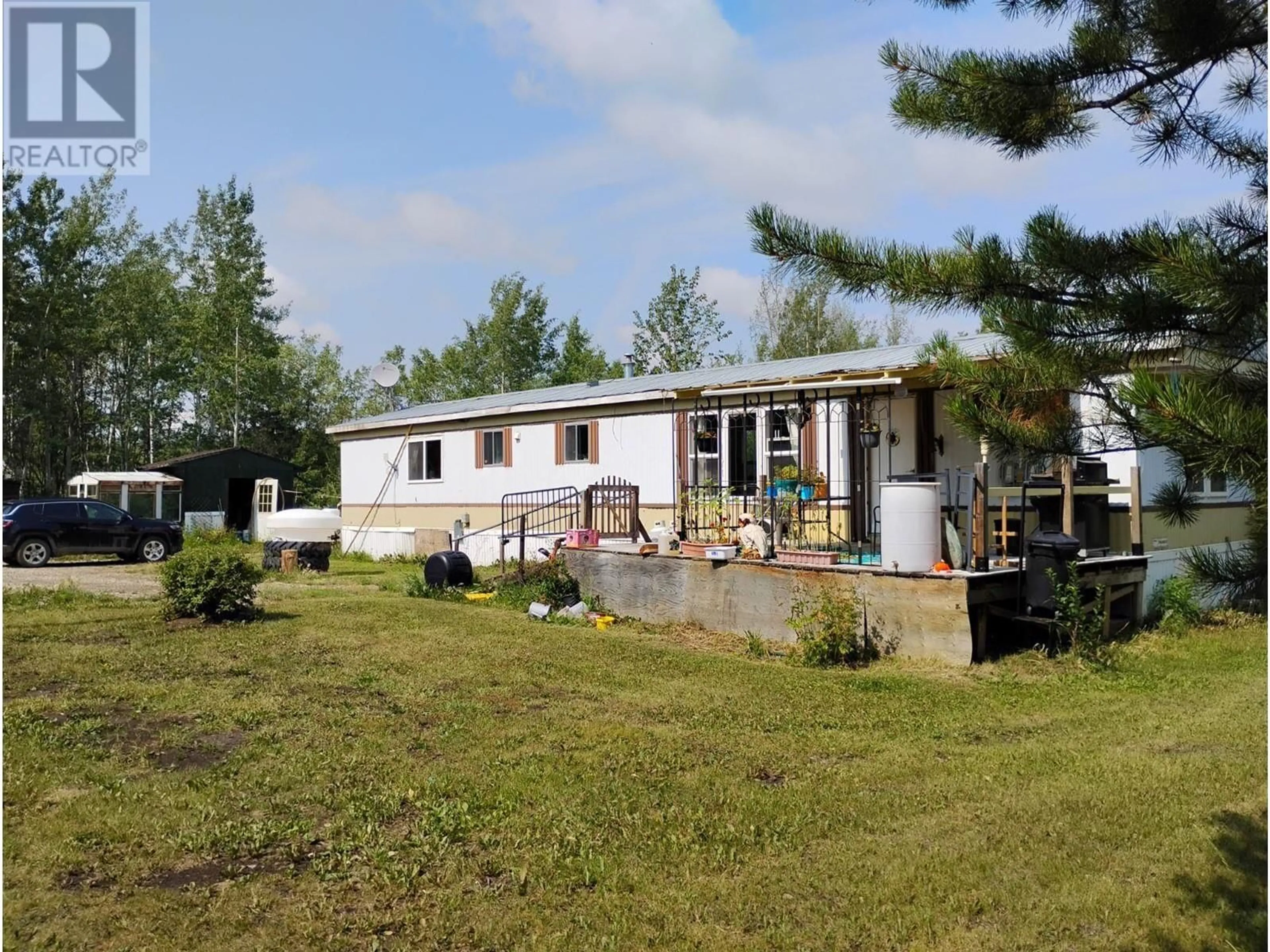 A pic from outside/outdoor area/front of a property/back of a property/a pic from drone, unknown for 4534 Miller Road, Dawson Creek British Columbia V1G0J3