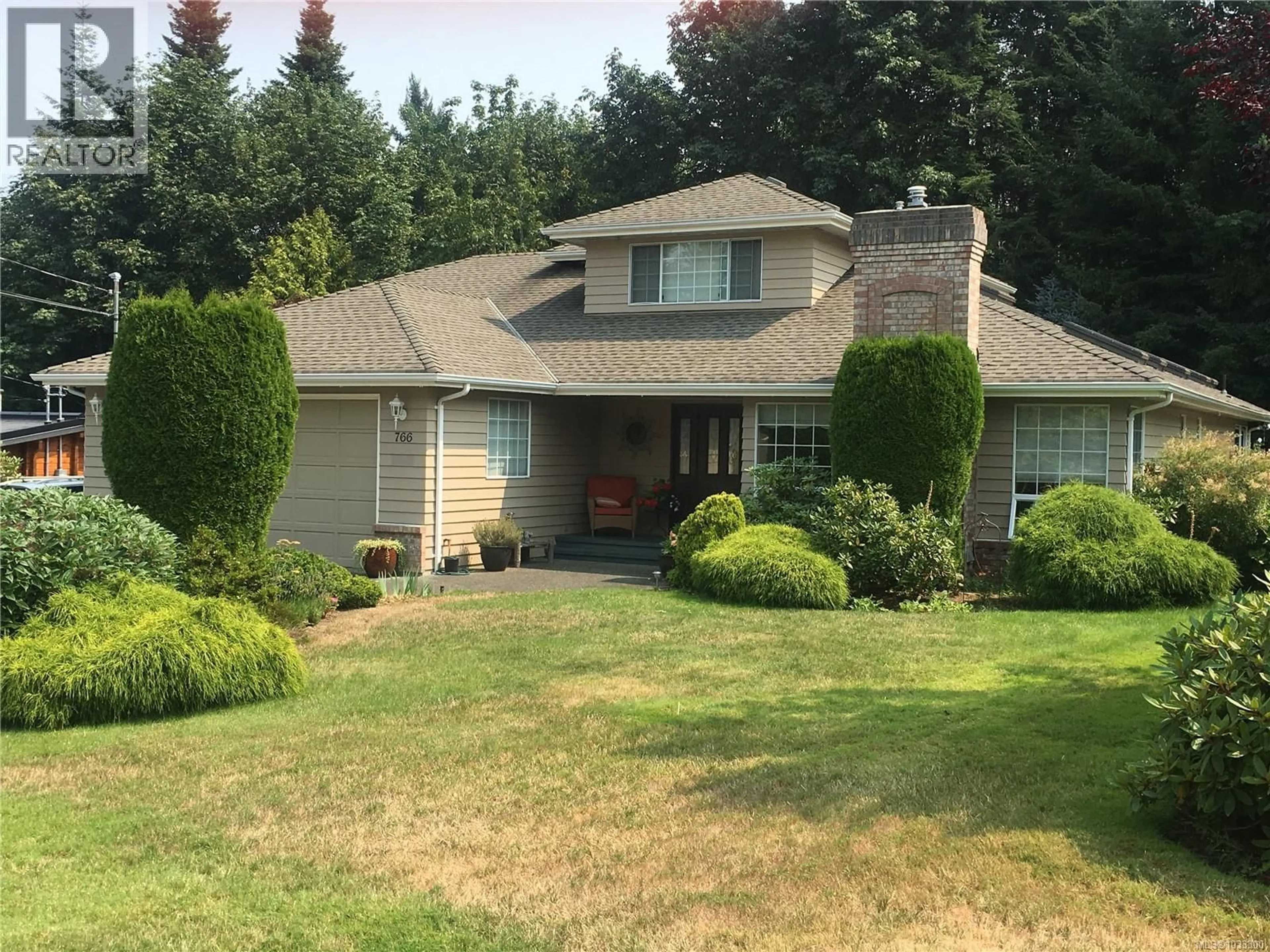 Home with vinyl exterior material, street for 766 CANYON CRESCENT, Qualicum Beach British Columbia V9K1K9