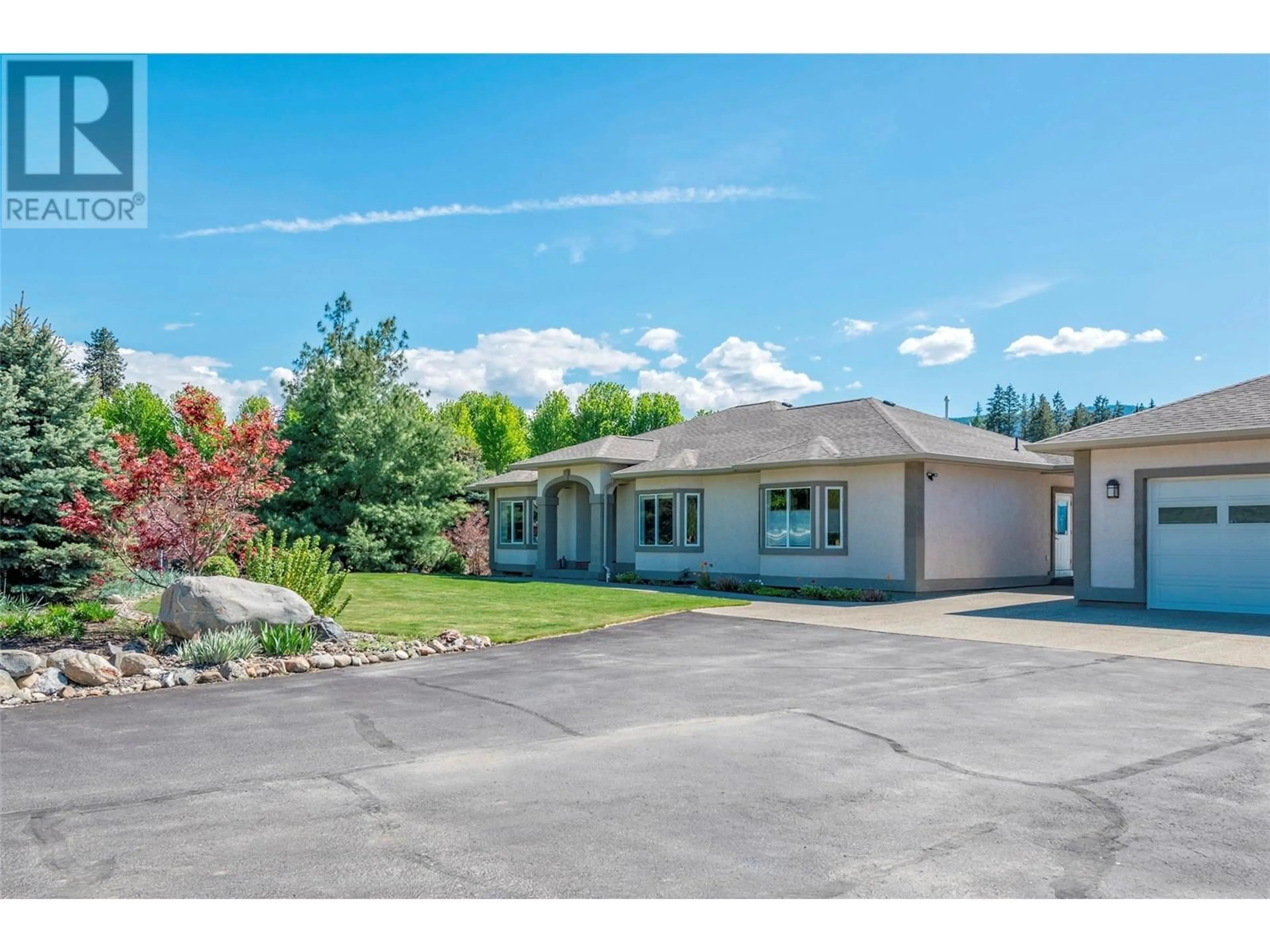 A pic from outside/outdoor area/front of a property/back of a property/a pic from drone, mountain view for 9474 Buchanan Road, Coldstream British Columbia V1B2X1