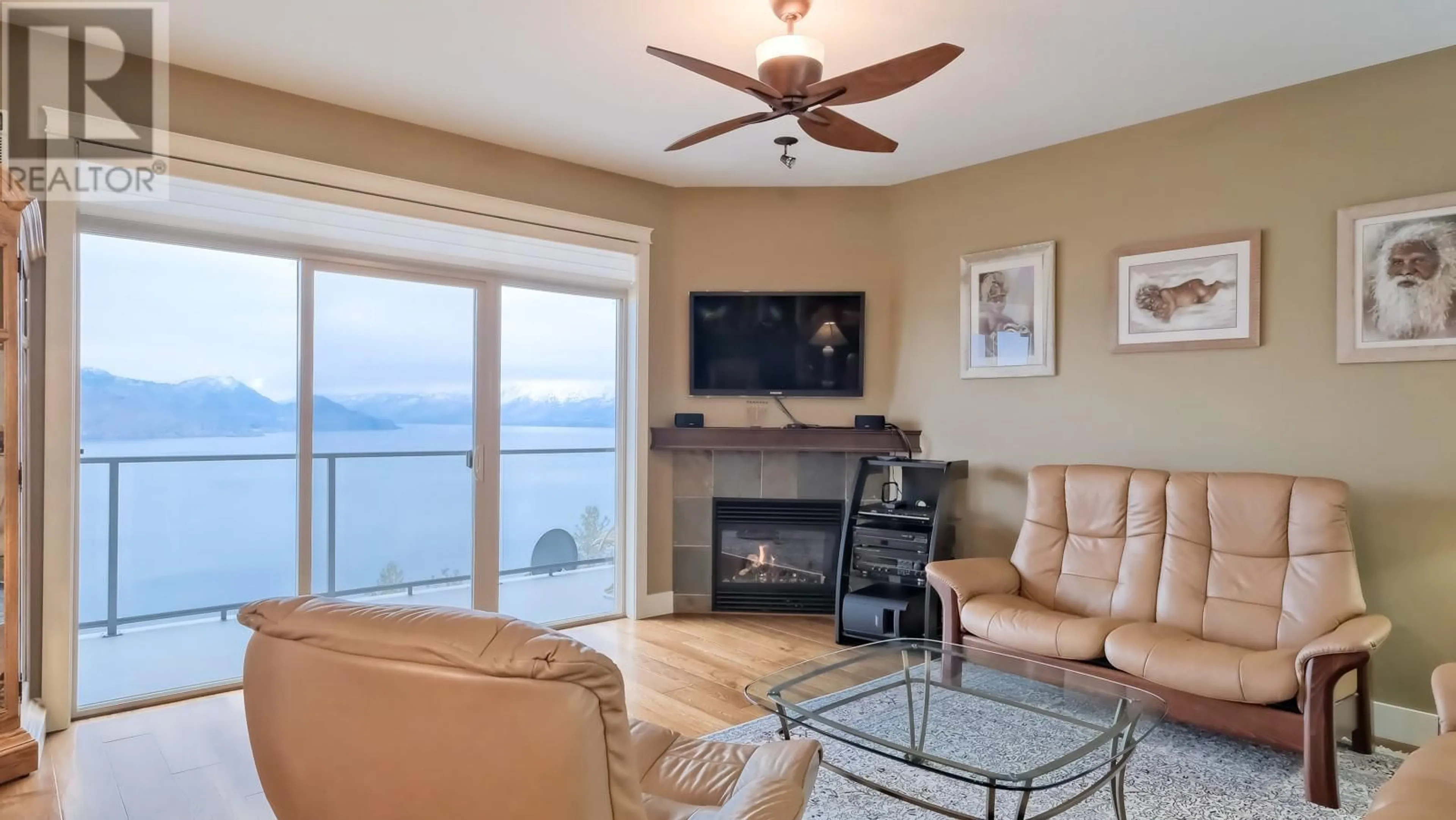 Living room with furniture, wood/laminate floor for 222 - 4350 PONDEROSA DRIVE, Peachland British Columbia V0H1X5