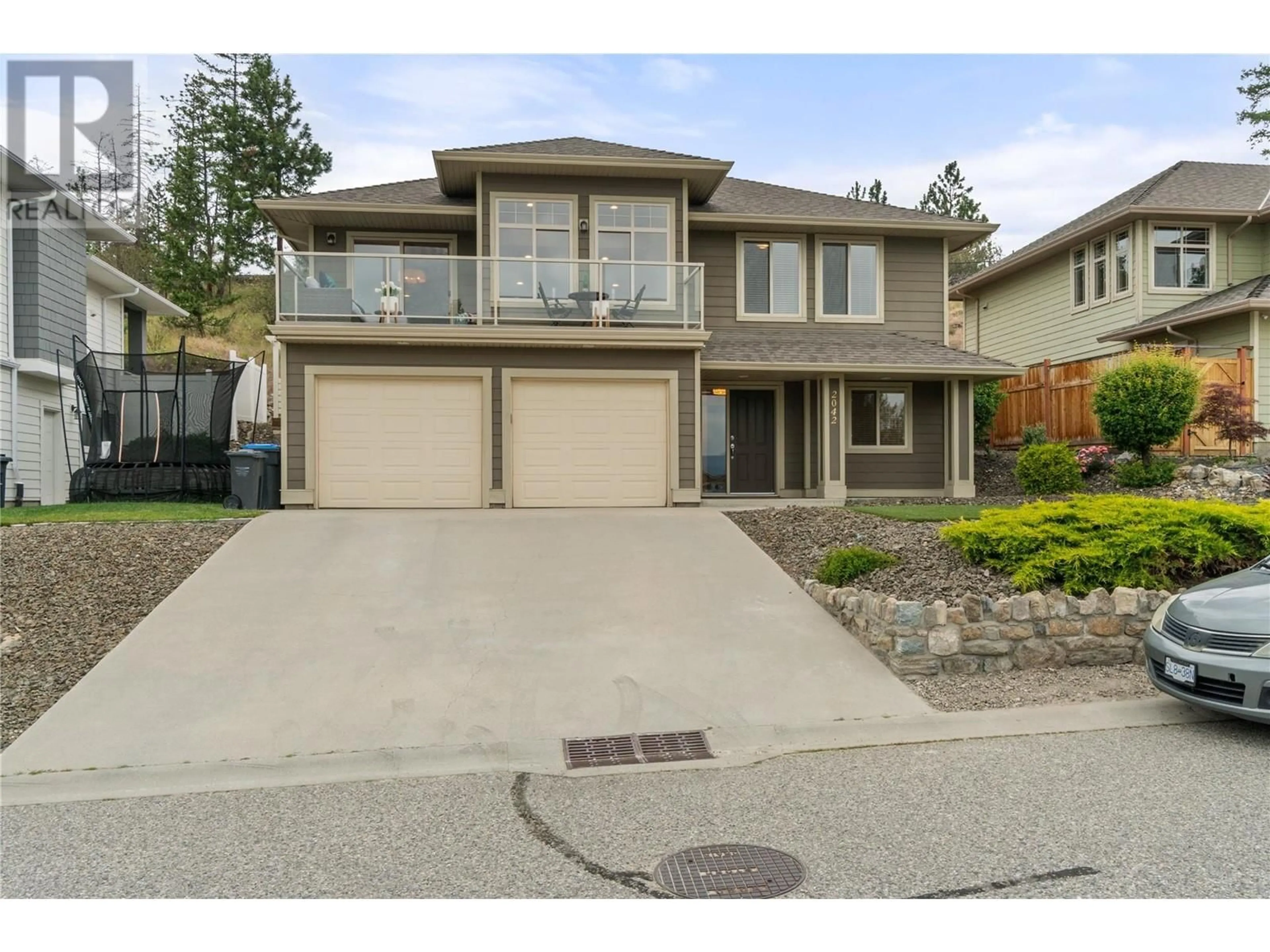 Home with vinyl exterior material, street for 2042 Moonbeam Close, West Kelowna British Columbia V1Z3X9