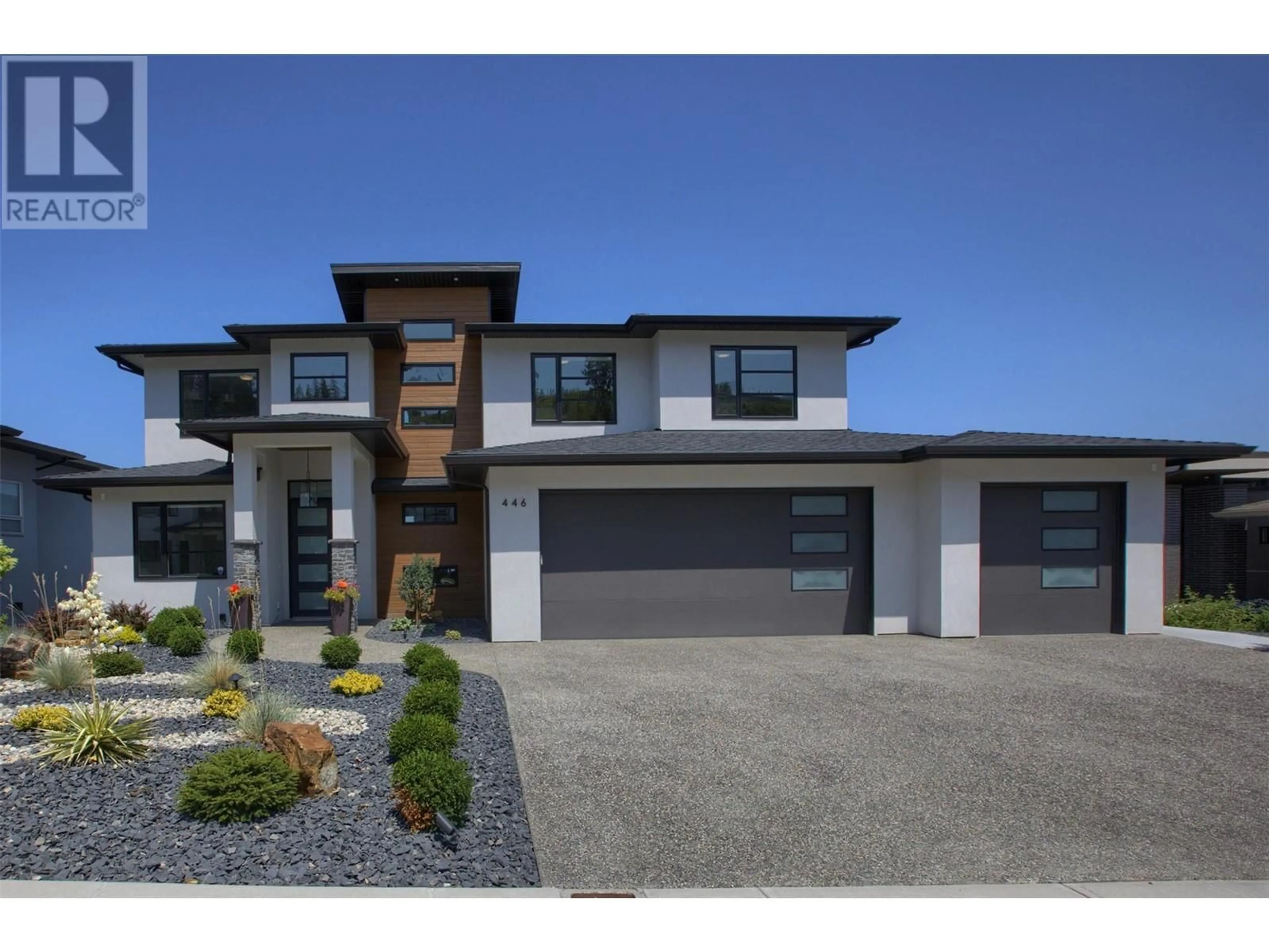 Home with brick exterior material, street for 446 Hawk Hill Drive, Kelowna British Columbia V1W0B1