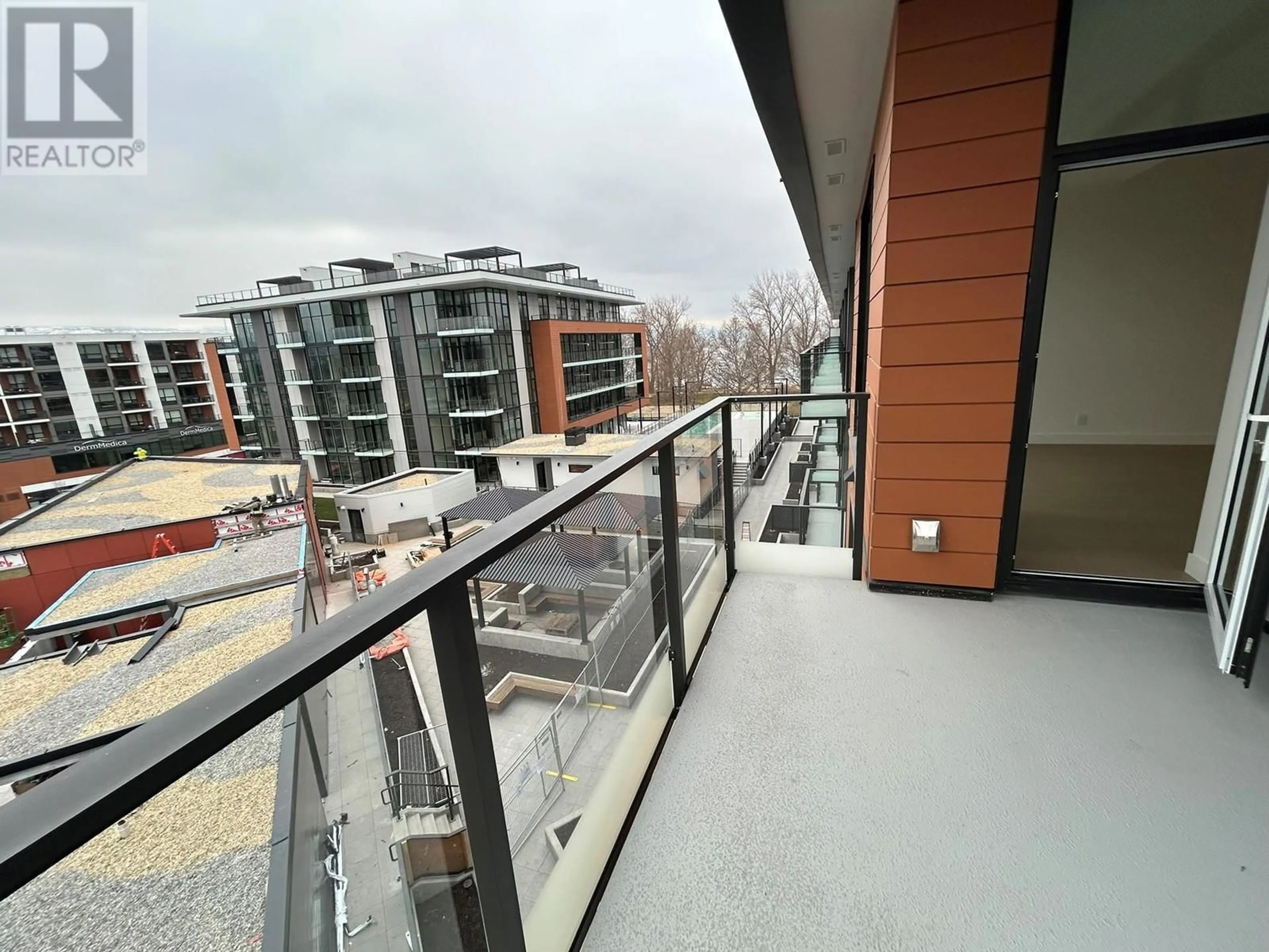 Balcony in the apartment, city buildings view from balcony for 3389 Lakeshore Road Unit# N508, Kelowna British Columbia V1W2R5