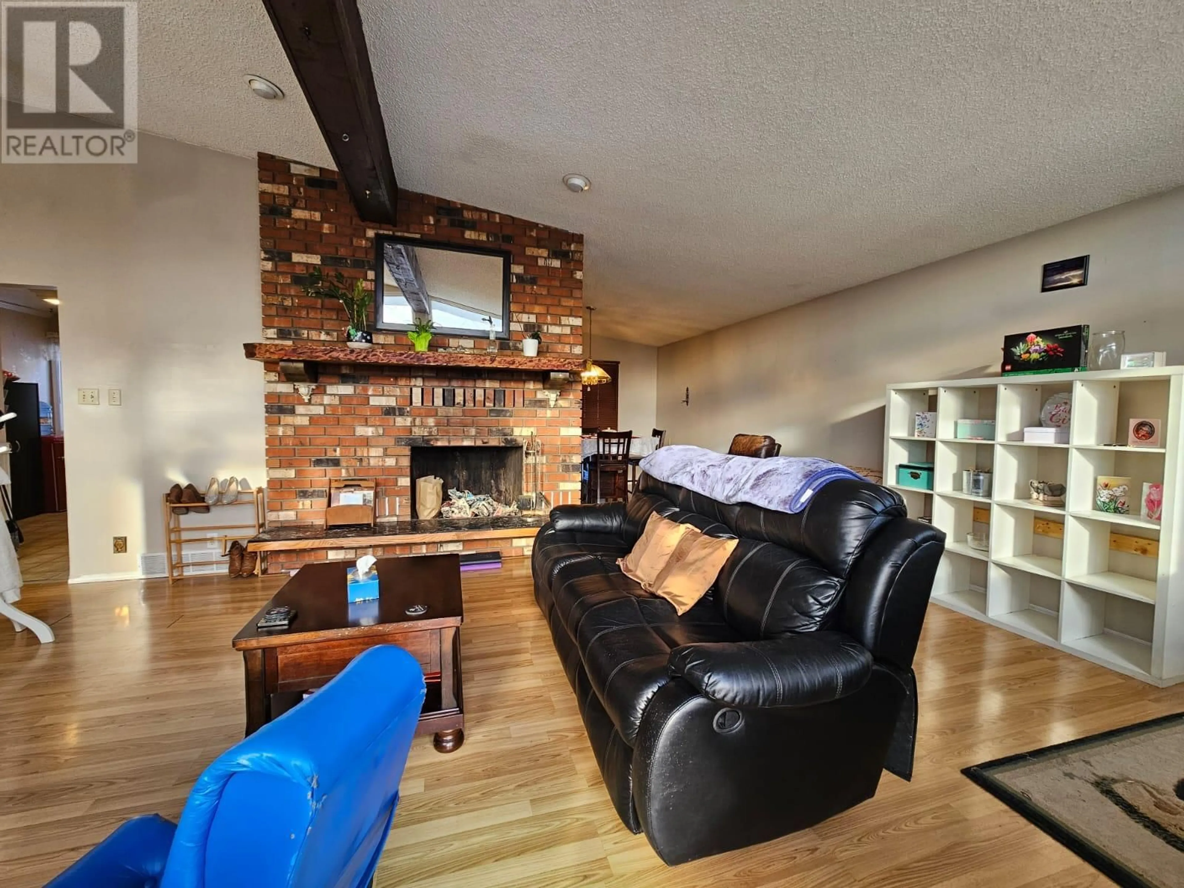 Living room with furniture, wood/laminate floor for 6340 Campbell Road, Chetwynd British Columbia V0C1J0