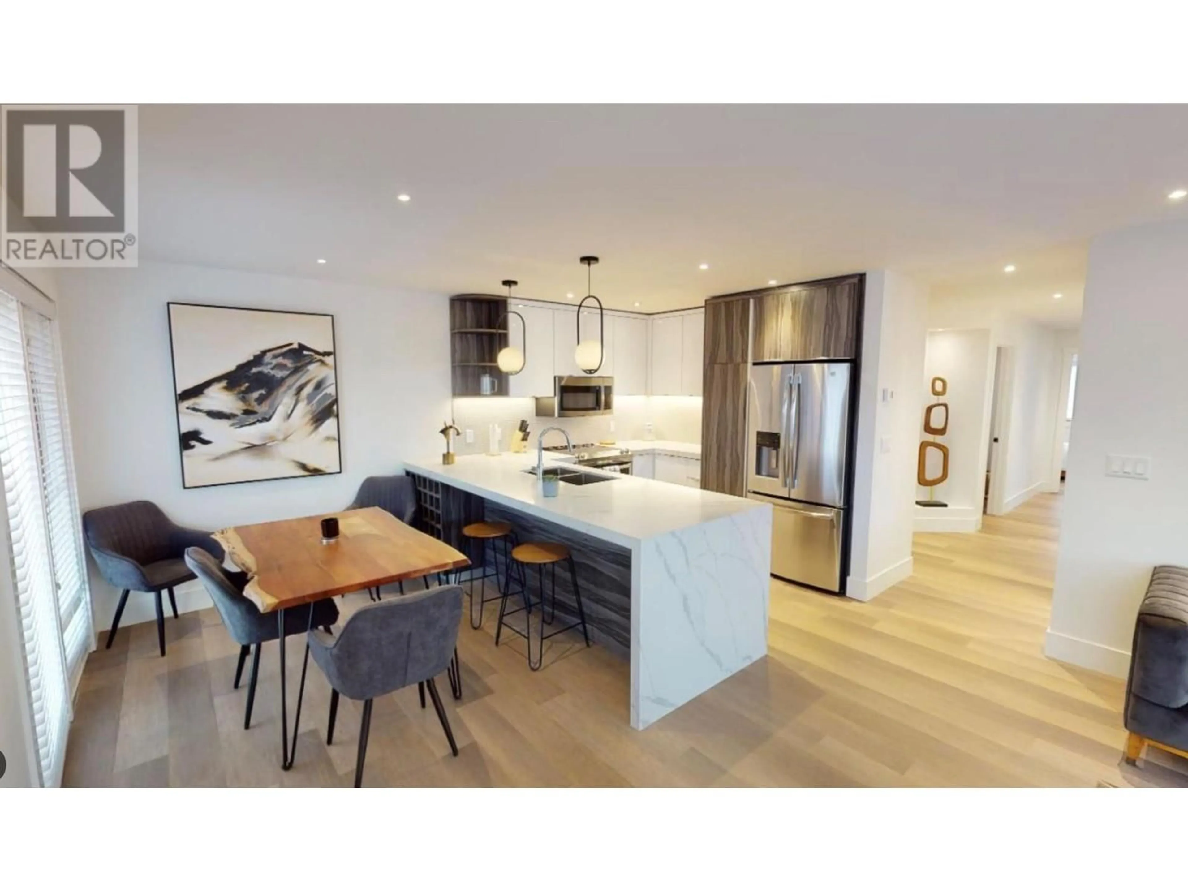 Open concept kitchen, wood/laminate floor for 7291 Prospector Avenue Unit# 403, Radium Hot Springs British Columbia V0A1M0