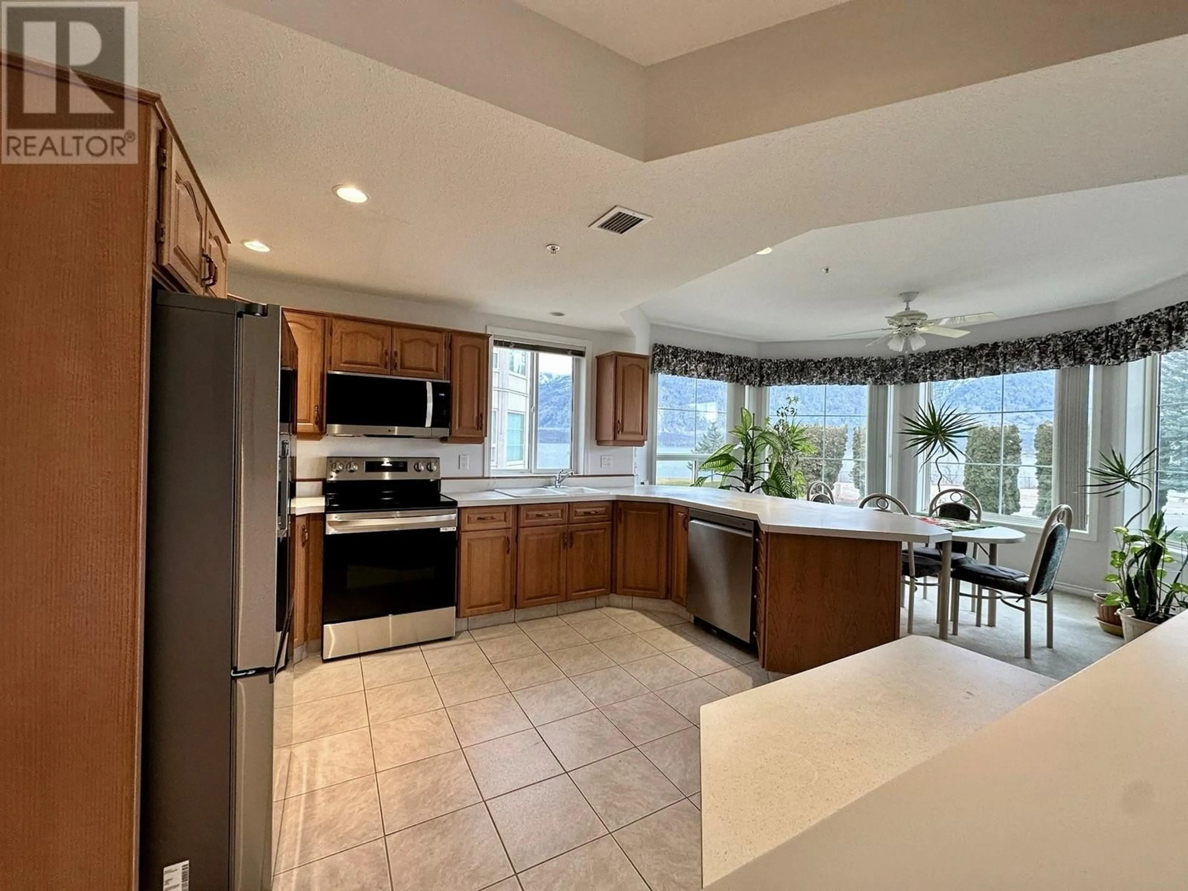 Open concept kitchen, ceramic/tile floor for 7801 SPARTAN Drive Unit# 215, Osoyoos British Columbia V0H1V0