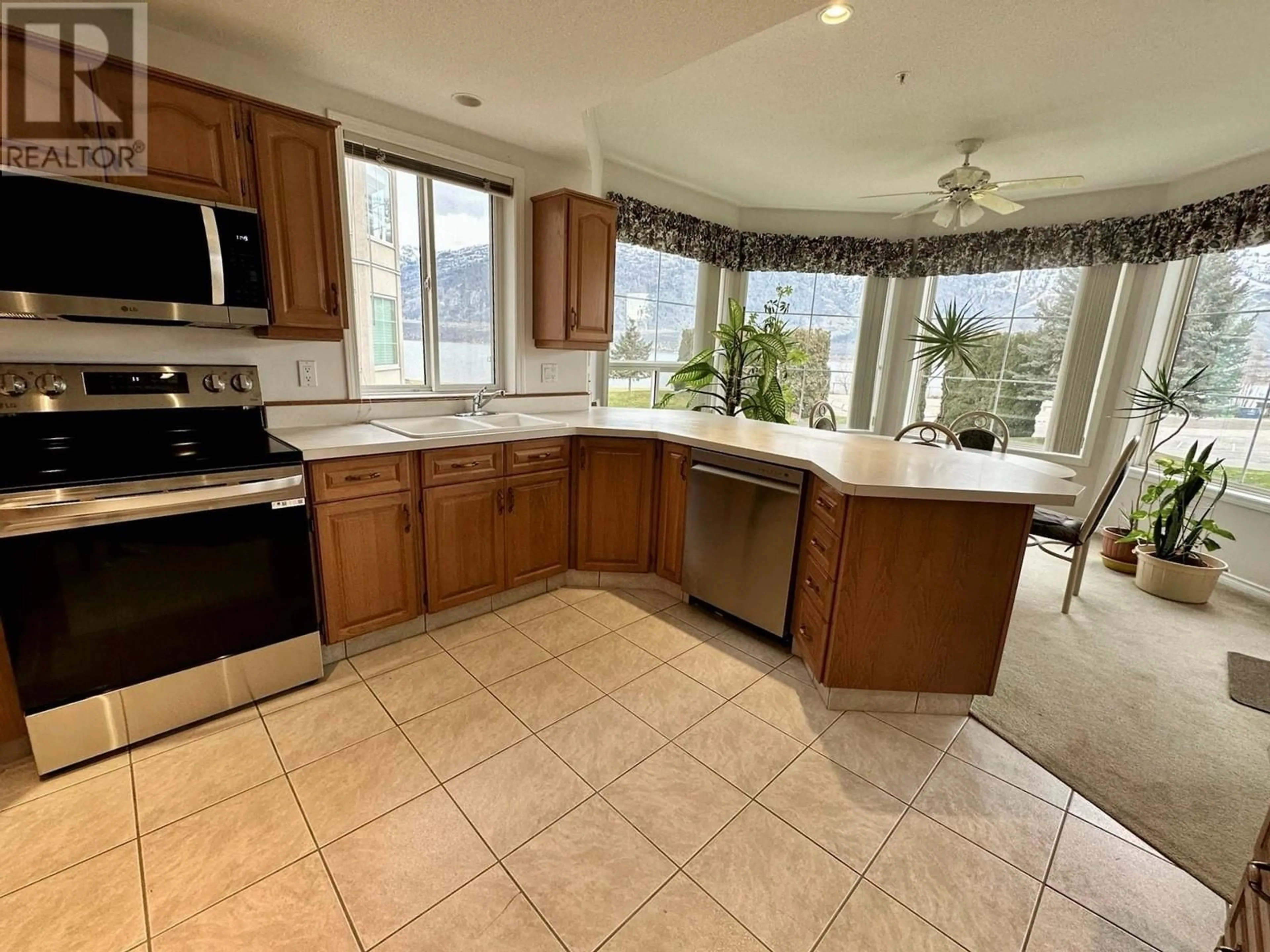 Open concept kitchen, ceramic/tile floor for 7801 SPARTAN Drive Unit# 215, Osoyoos British Columbia V0H1V0